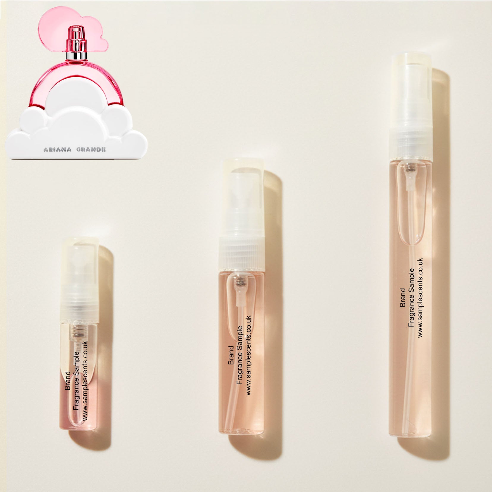 Perfume sample atomisers shown for size reference, hand-decanted from Ariana Grande Cloud Pink bottle.