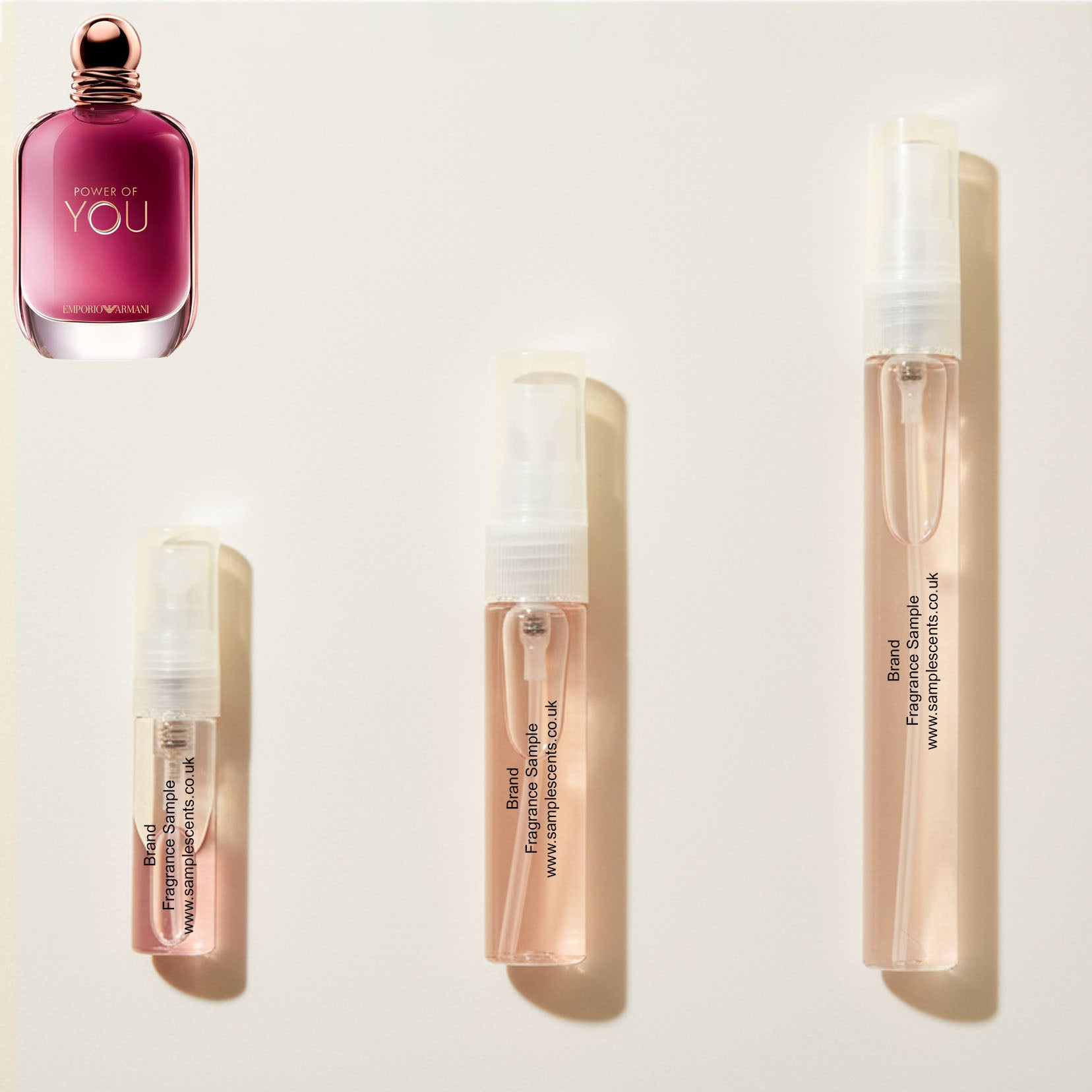 Perfume sample atomisers shown for size reference, hand-decanted from Armani Power Of You bottle.