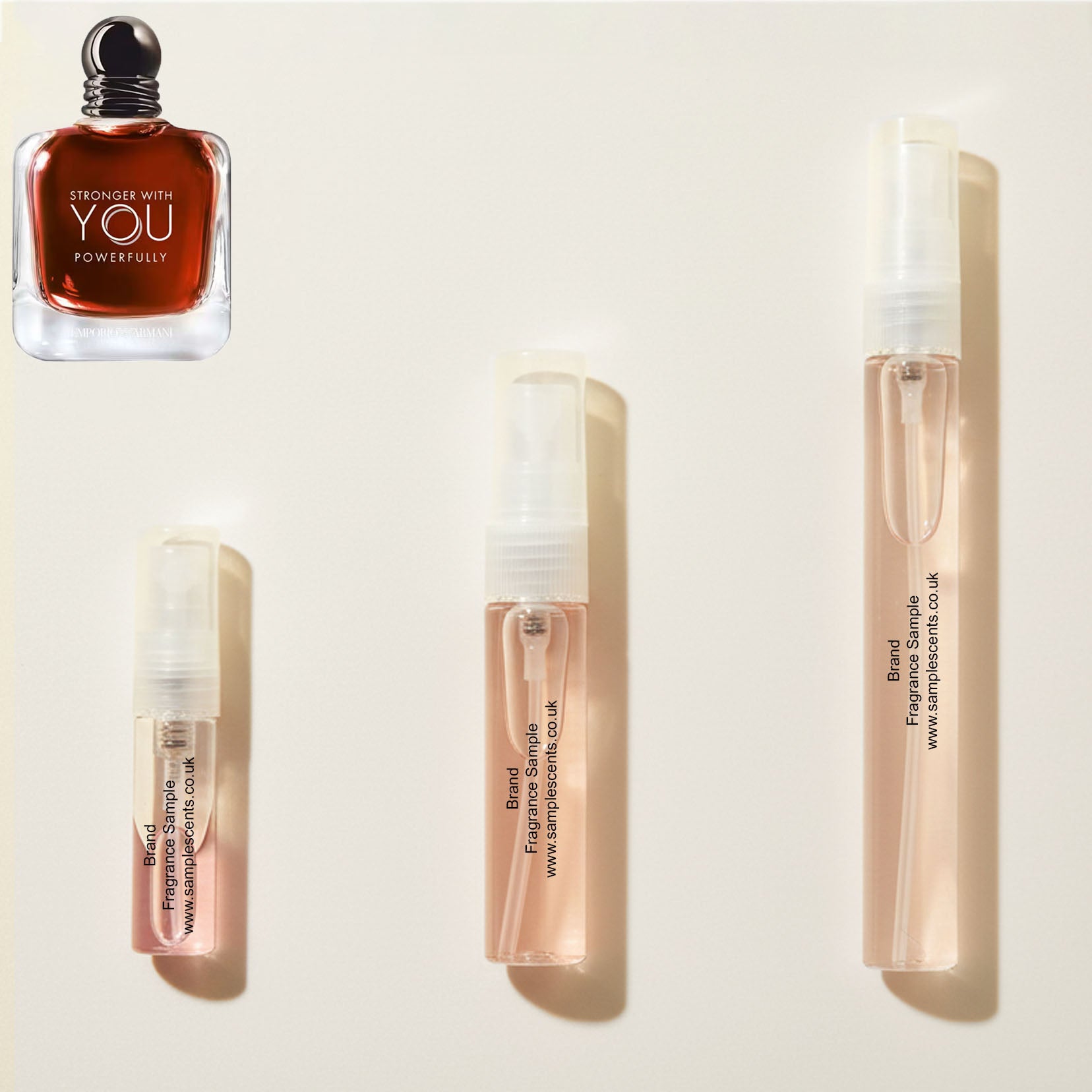 Perfume sample atomisers shown for size reference, hand-decanted from Armani Stronger With You Powerfully bottle.