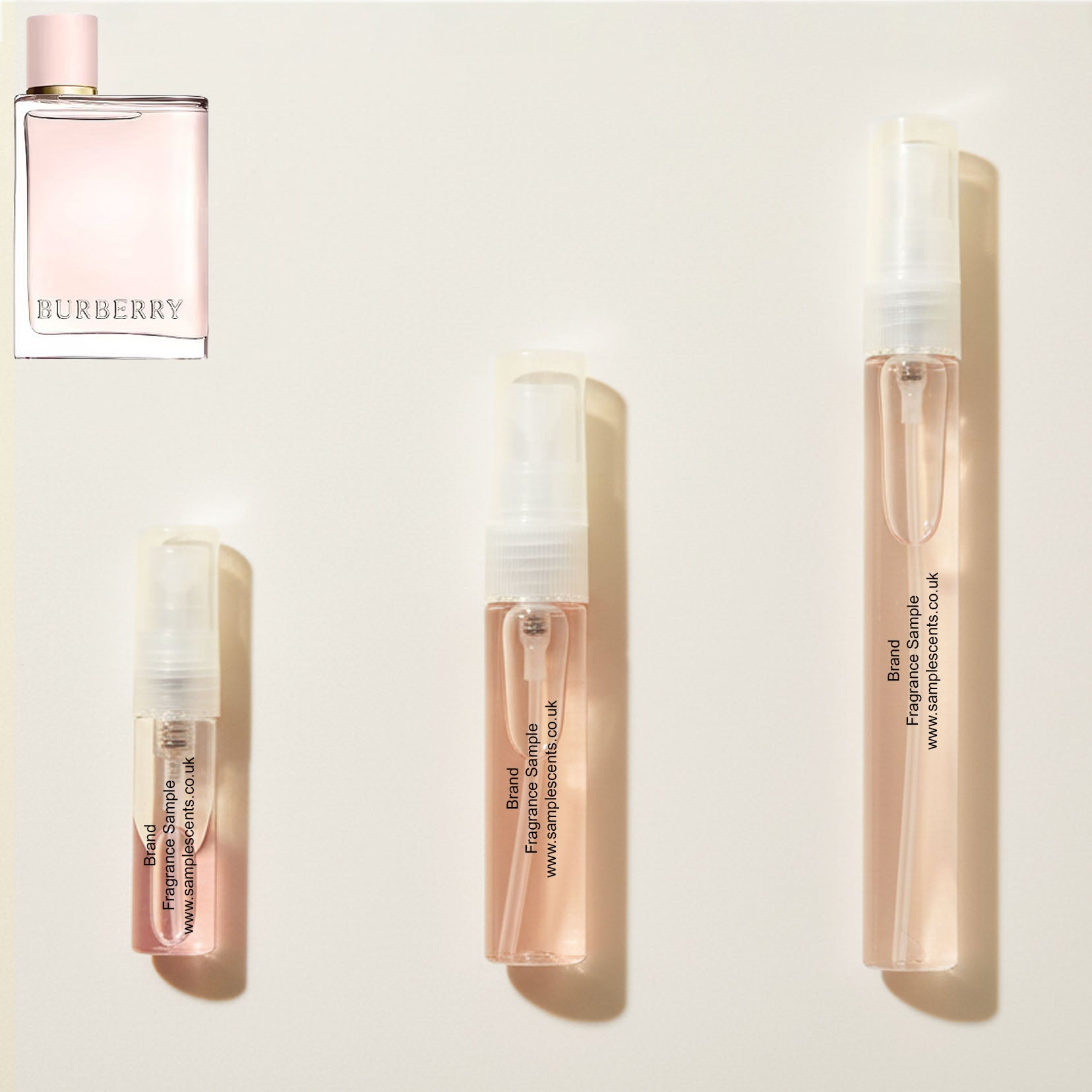 Perfume sample atomisers shown for size reference, hand-decanted from Burberry For Her EDP bottle.