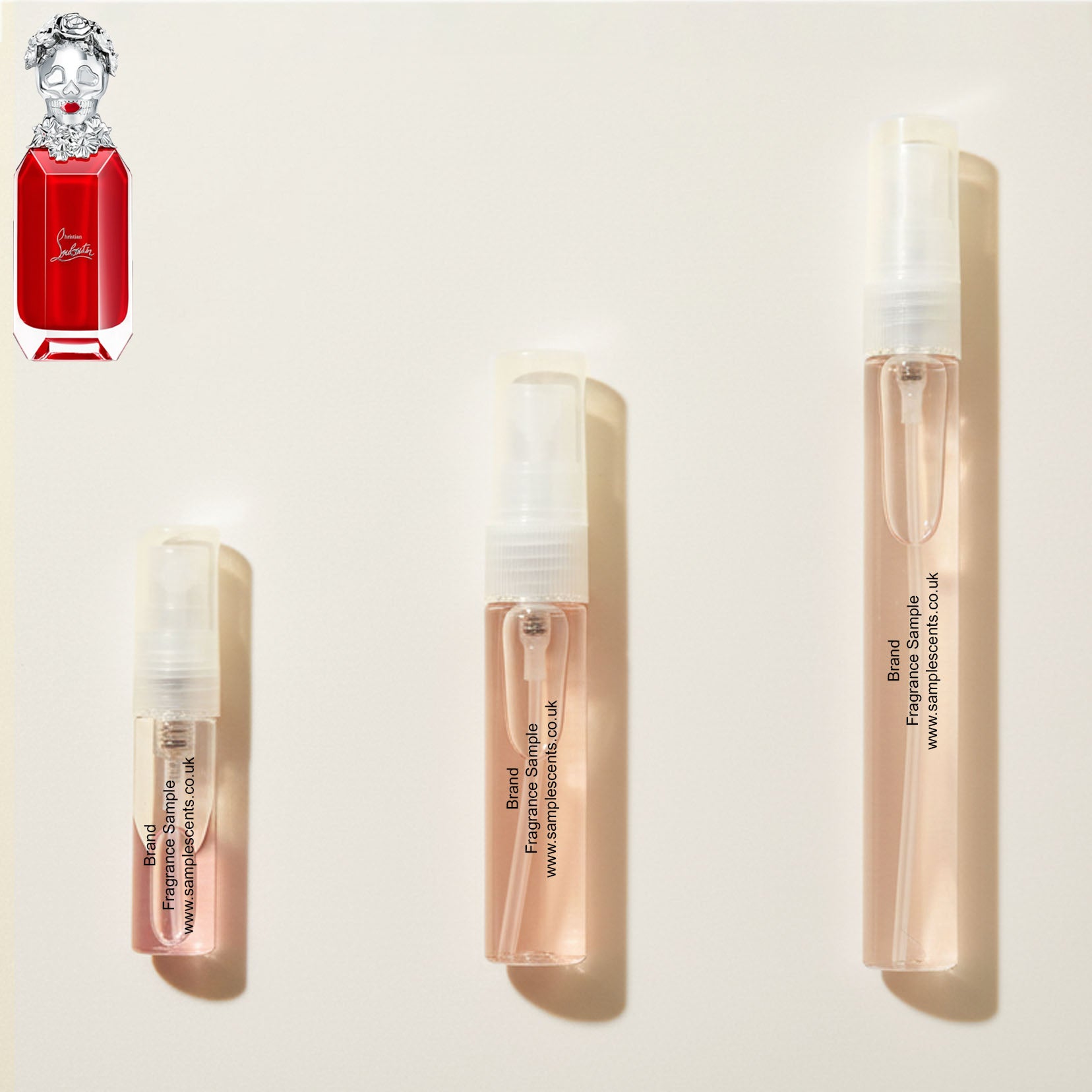 Perfume sample atomisers shown for size reference, hand-decanted from Christian Louboutin Loubikiss bottle.
