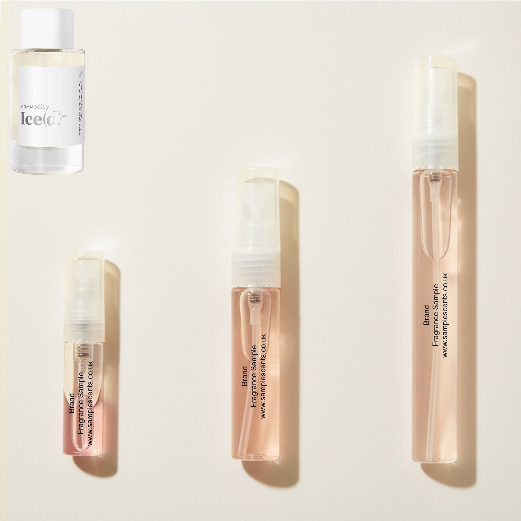 Perfume sample atomisers shown for size reference, hand-decanted from Commodity Ice(d) Personal bottle.