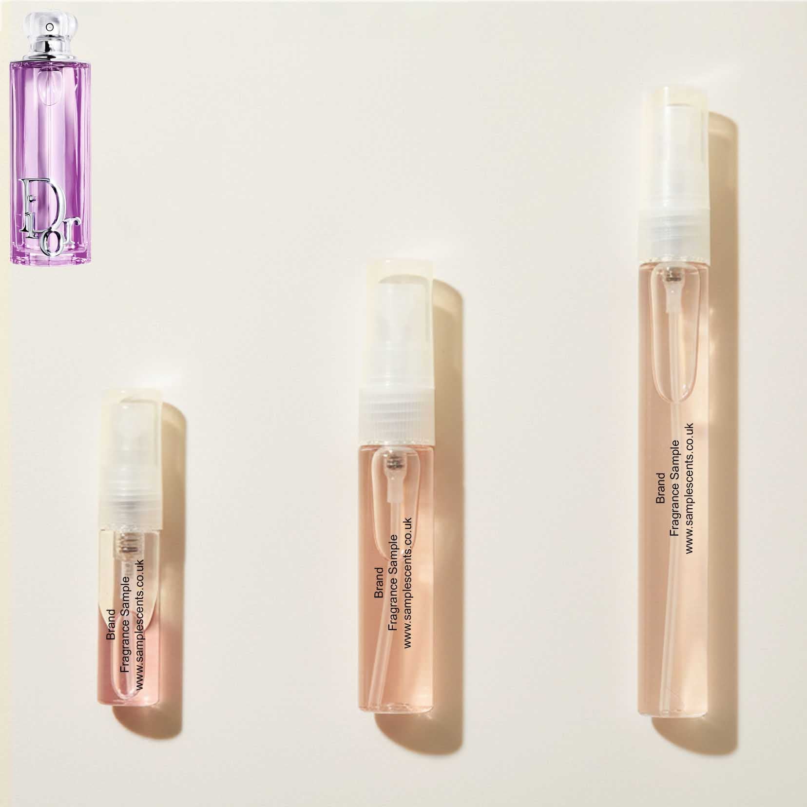 Perfume sample atomisers shown for size reference, hand-decanted from Dior Addict Purple Glow bottle.