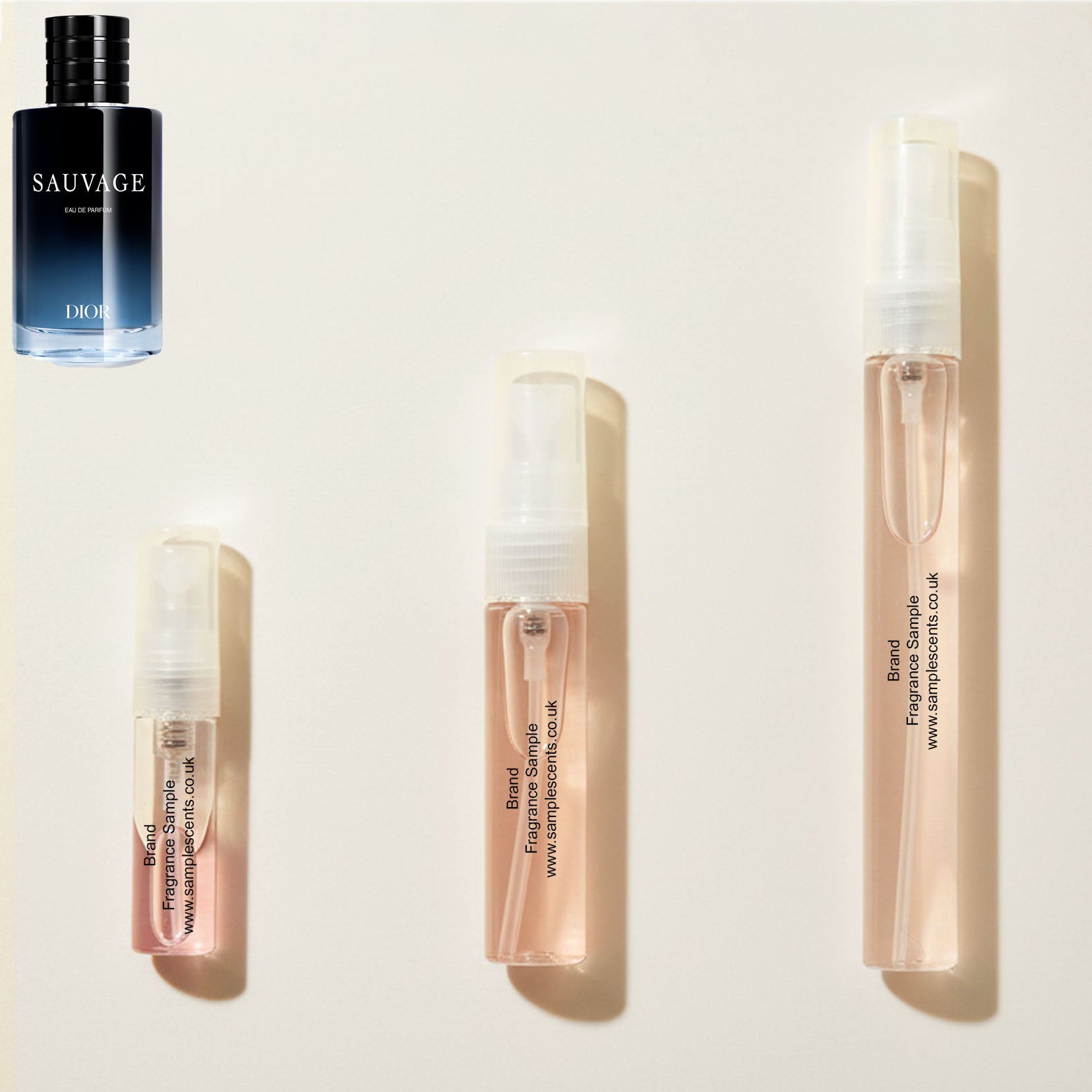 Perfume sample atomisers shown for size reference, hand-decanted from Dior Sauvage EDP bottle.