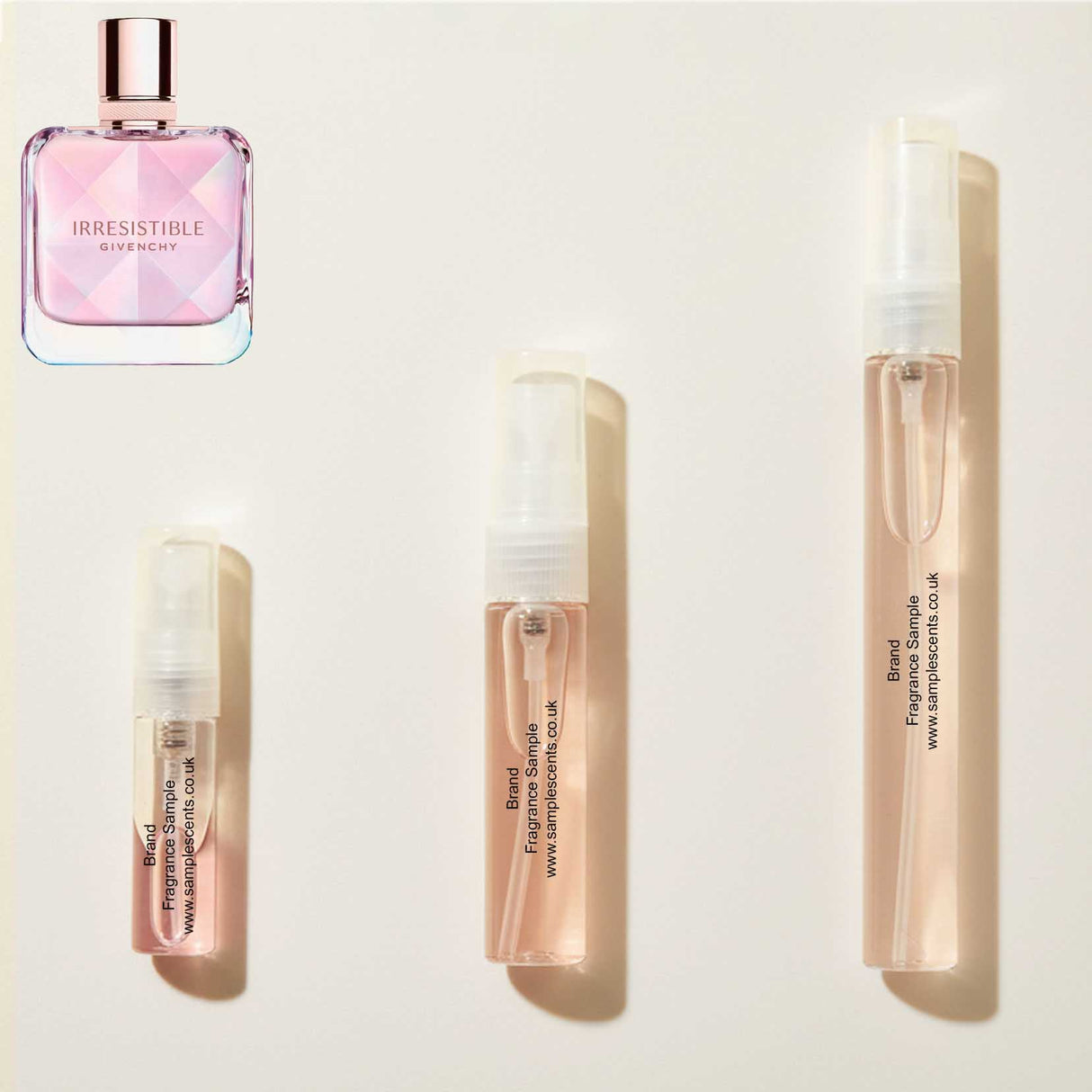 Perfume sample atomisers shown for size reference, hand-decanted from Givenchy Irresistible Nectar bottle.