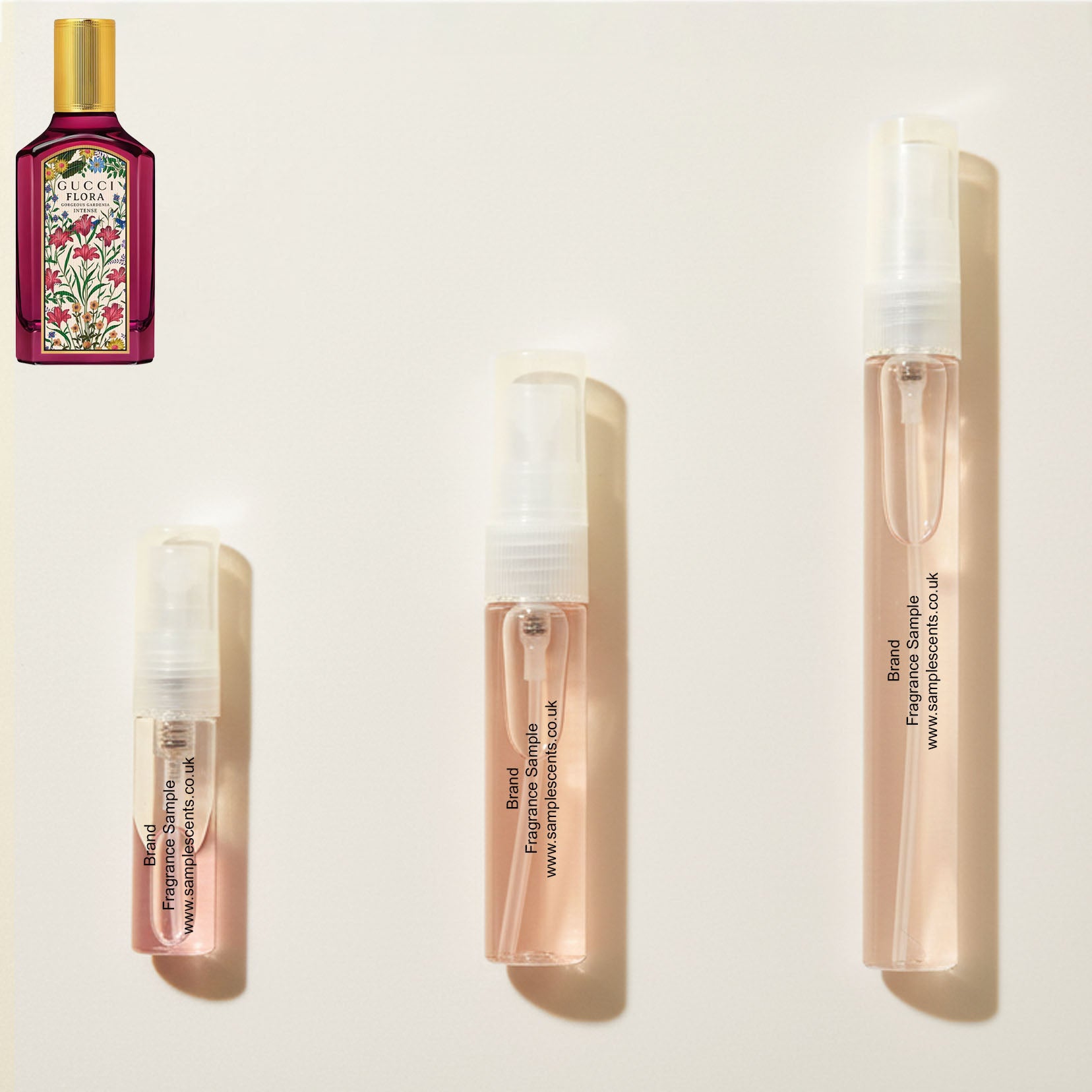 Perfume sample atomisers shown for size reference, hand-decanted from Gucci Flora Gorgeous Gardenia Intense bottle.