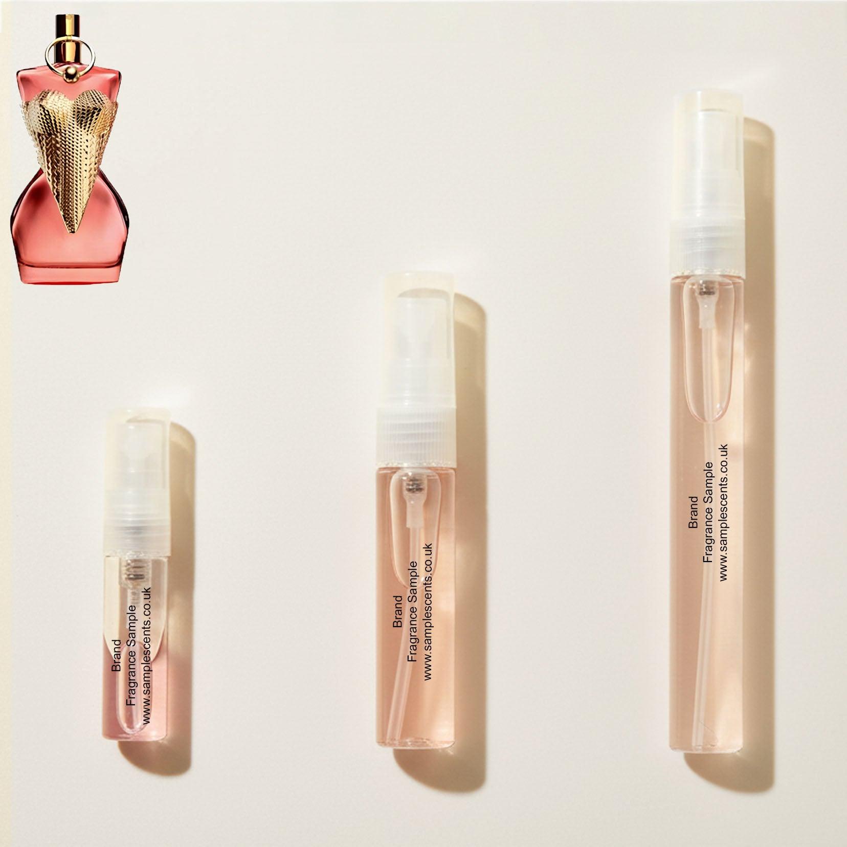 Perfume sample atomisers shown for size reference, hand-decanted from Jean Paul Gualtier Divine Couture bottle.