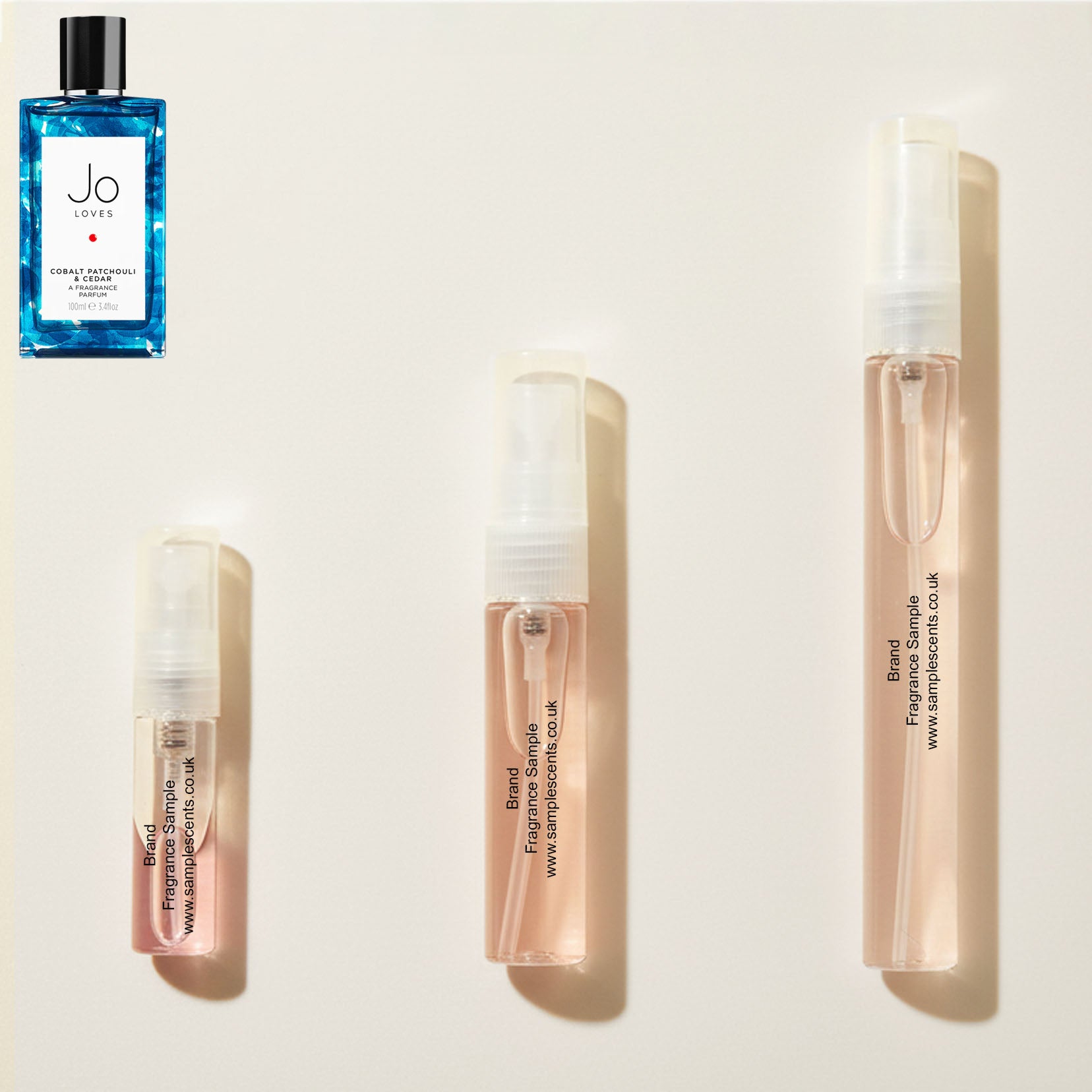 Perfume sample atomisers shown for size reference, hand-decanted from Jo Loves Cobalt Patchouli & Cedar Flower bottle.