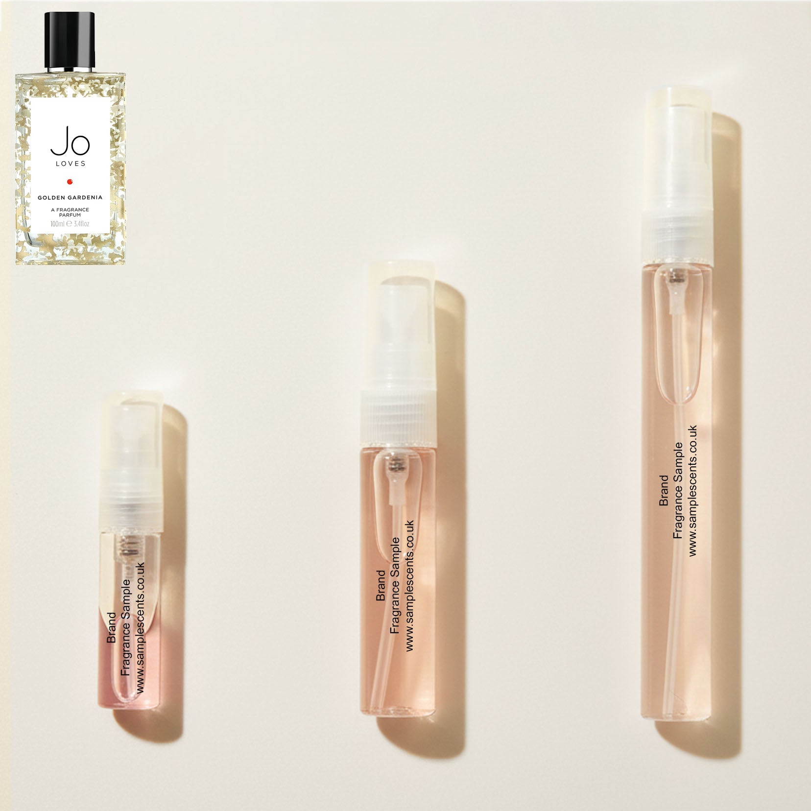 Perfume sample atomisers shown for size reference, hand-decanted from Jo Loves Golden Gardenia bottle.