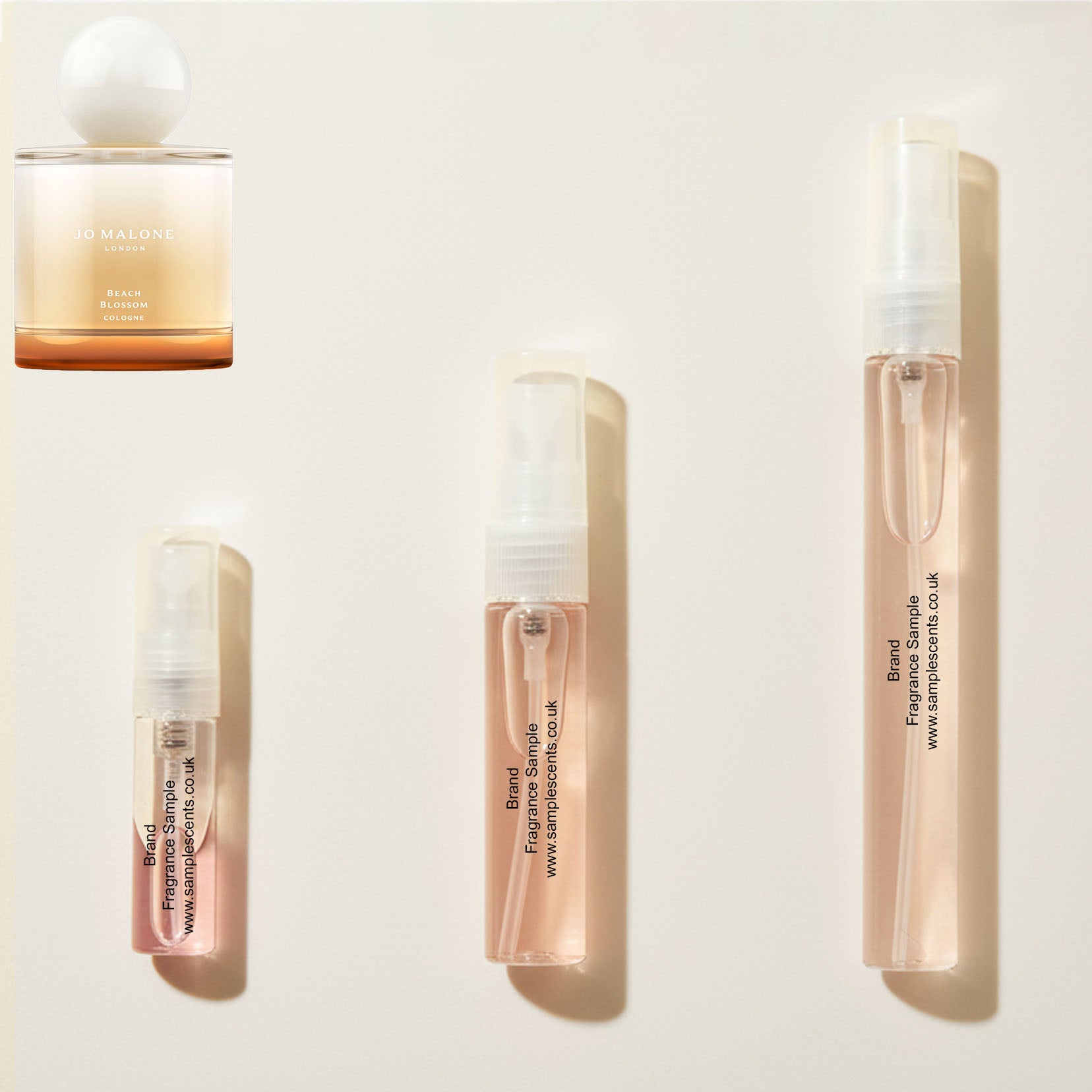 Perfume sample atomisers shown for size reference, hand-decanted from Jo Malone London Beach Blossom bottle.