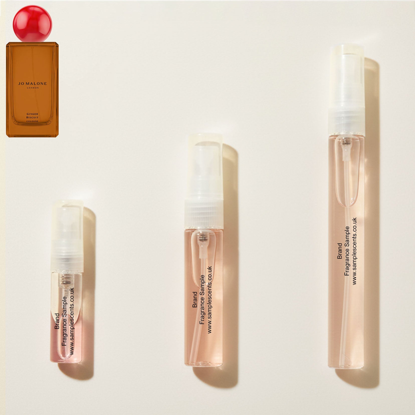 Perfume sample atomisers shown for size reference, hand-decanted from Jo Malone London Ginger Biscuit bottle.
