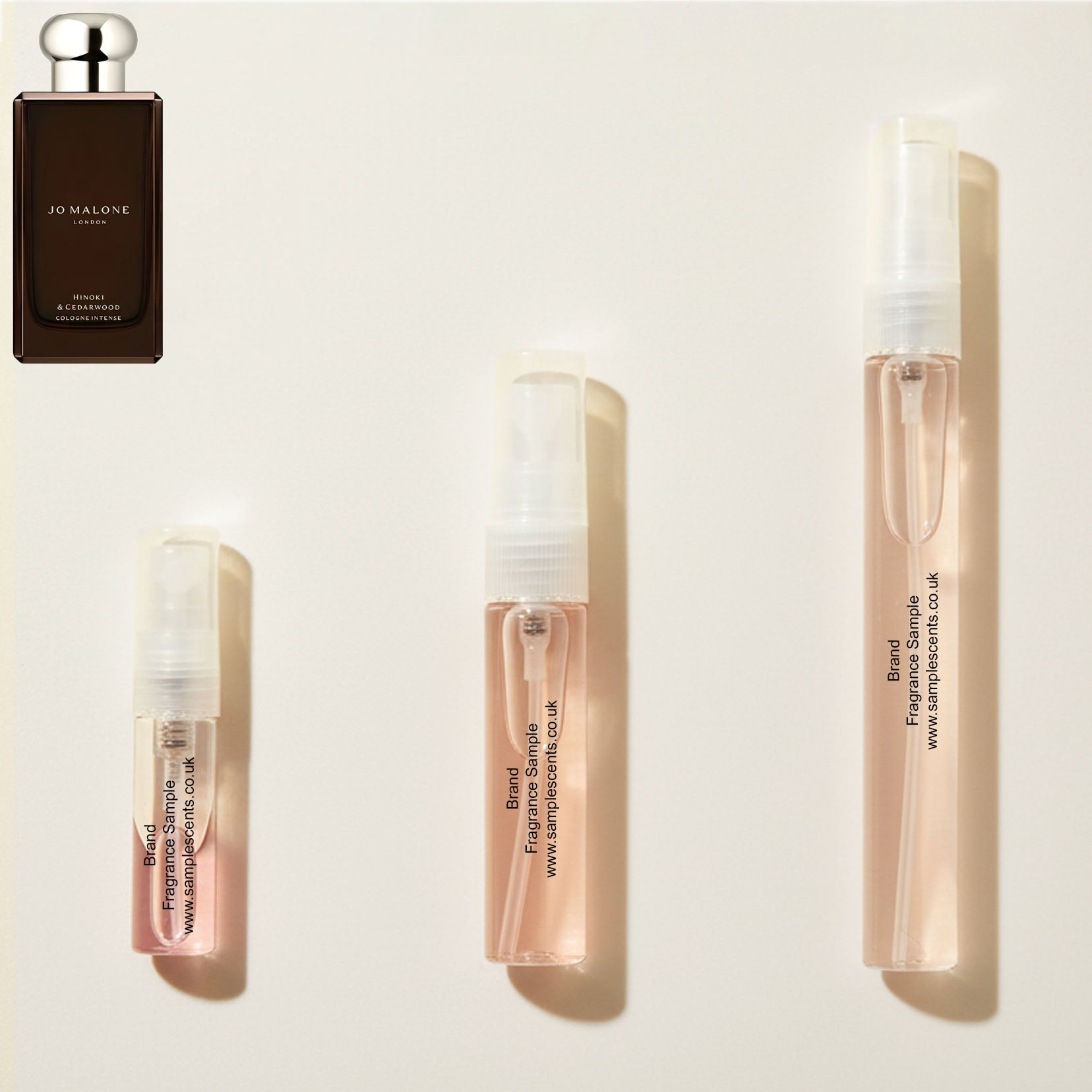 Perfume sample atomisers shown for size reference, hand-decanted from Jo Malone London Hinoki & Cedarwood bottle.