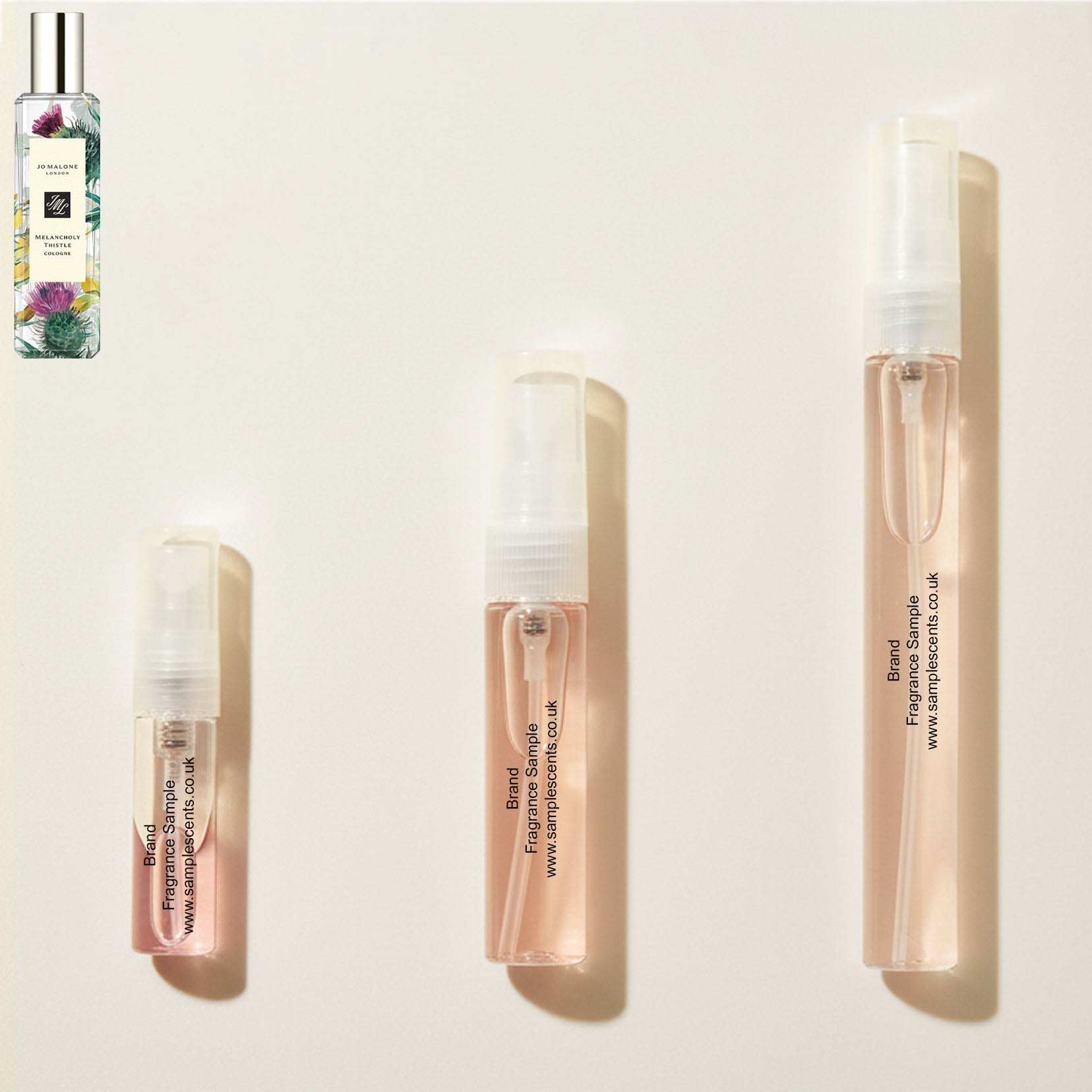 Perfume sample atomisers shown for size reference, hand-decanted from Jo Malone London Melancholy Thistle bottle.