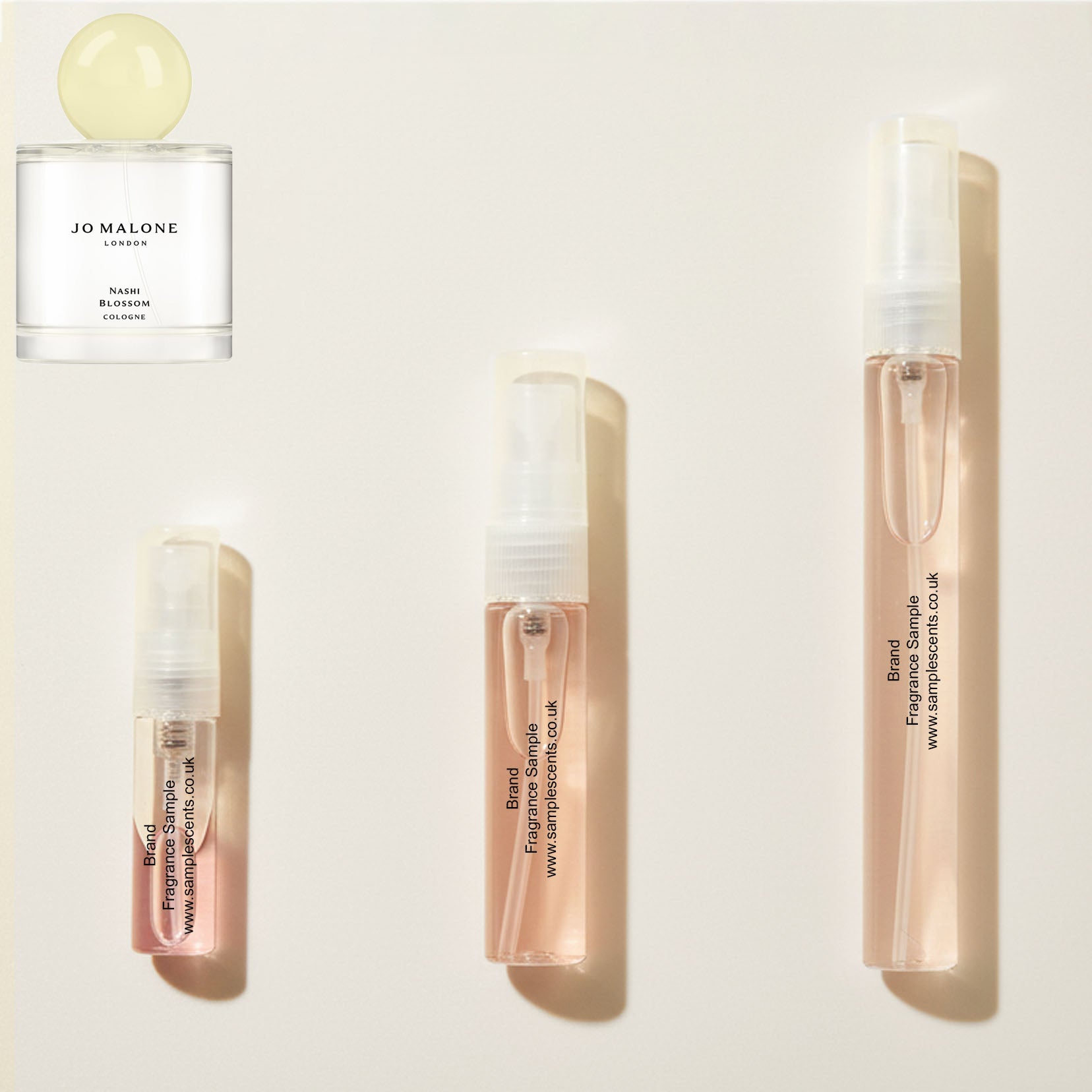 Perfume sample atomisers shown for size reference, hand-decanted from Jo Malone London Nashi Blossom bottle.