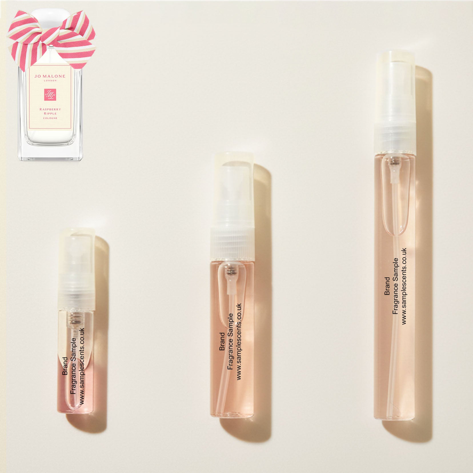 Perfume sample atomisers shown for size reference, hand-decanted from Jo Malone London Raspberry Ripple bottle.