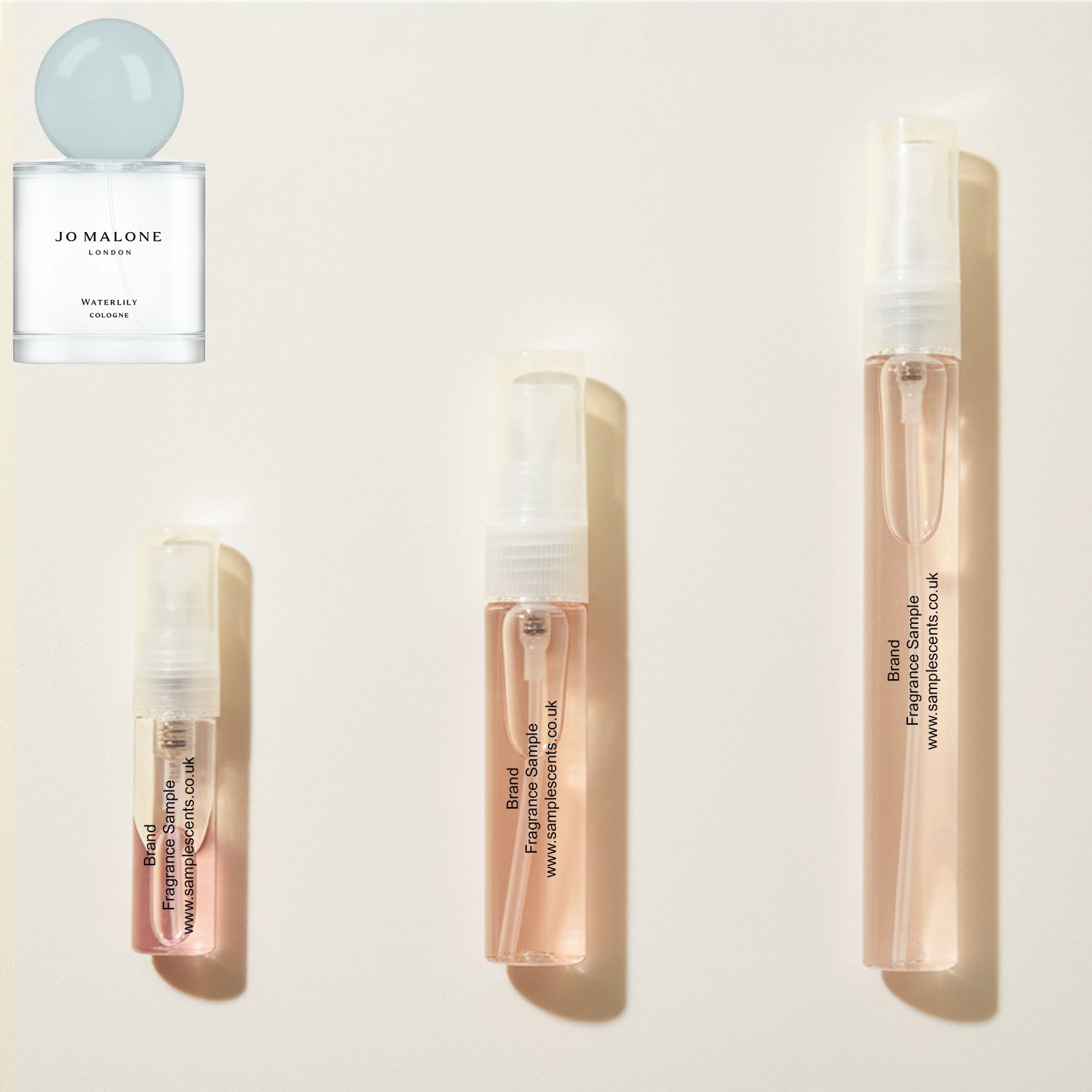 Perfume sample atomisers shown for size reference, hand-decanted from Jo Malone London Waterlily bottle.