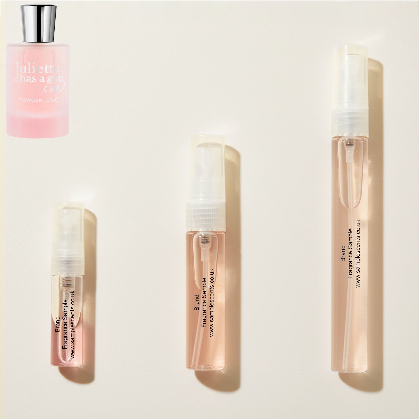 Perfume sample atomisers shown for size reference, hand-decanted from Juliette Has A Gun Powder Love bottle.