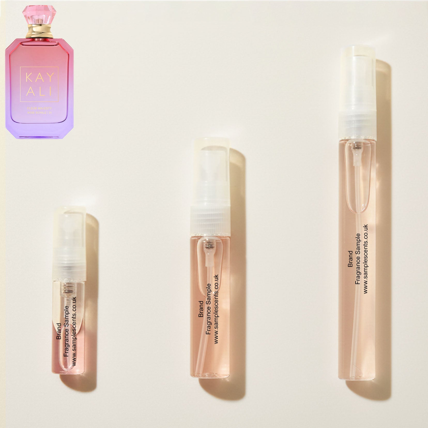 Perfume sample atomisers shown for size reference, hand-decanted from Kayali Fleur Majesty Rose Royale 31 bottle.