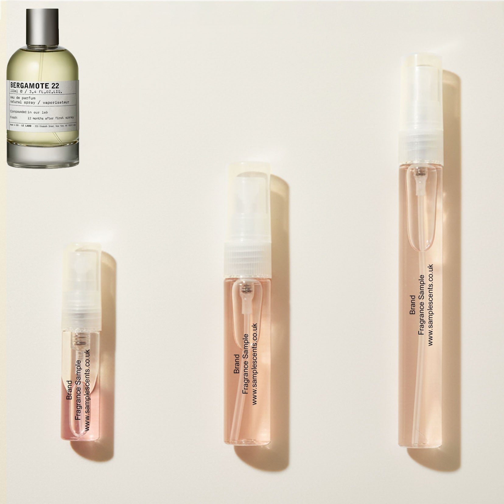 Perfume sample atomisers shown for size reference, hand-decanted from Le Labo Bergamote 22 bottle.