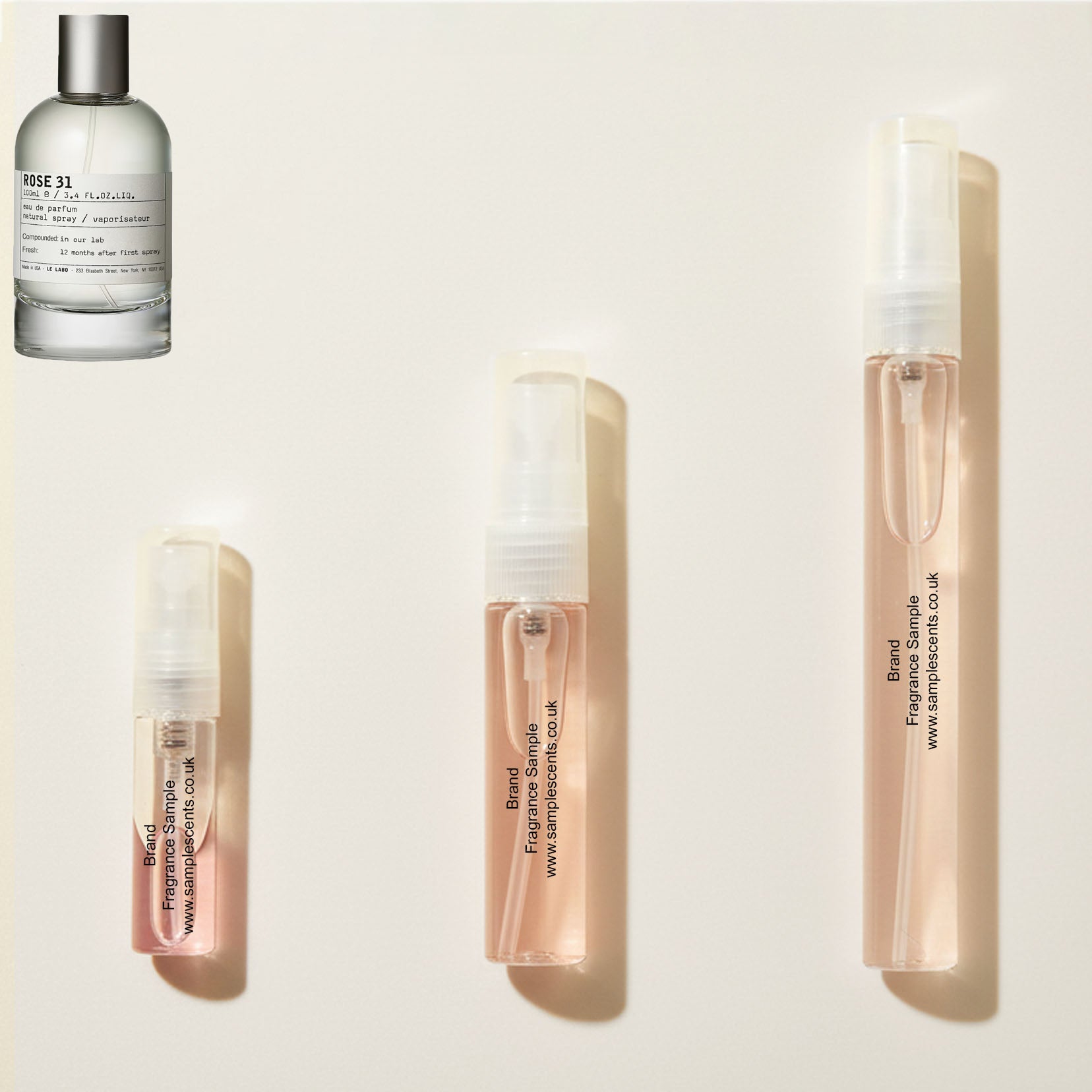 Perfume sample atomisers shown for size reference, hand-decanted from Le Labo Rose 31 bottle.