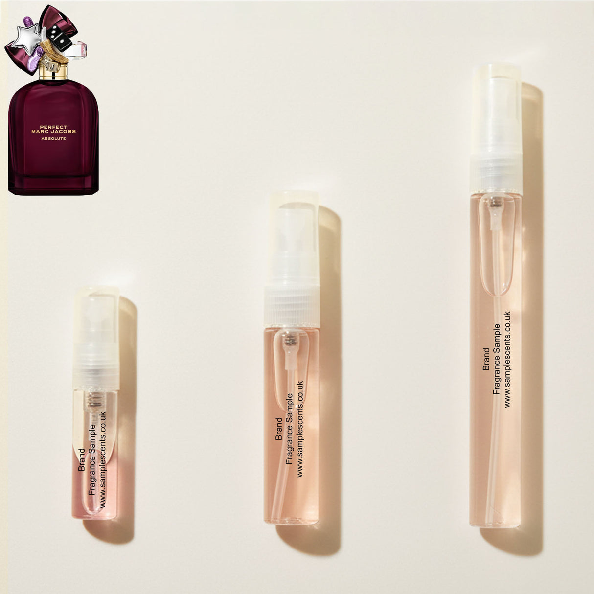 Perfume sample atomisers shown for size reference, hand-decanted from Marc Jacobs Perfect Absolute bottle.