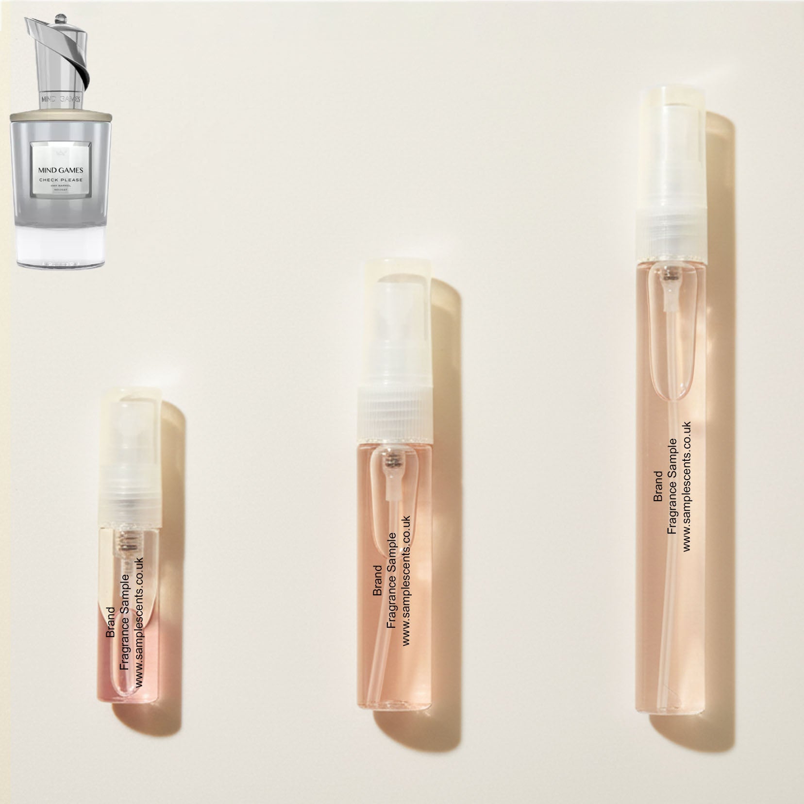 Perfume sample atomisers shown for size reference, hand-decanted from Mind Games Check Please bottle.