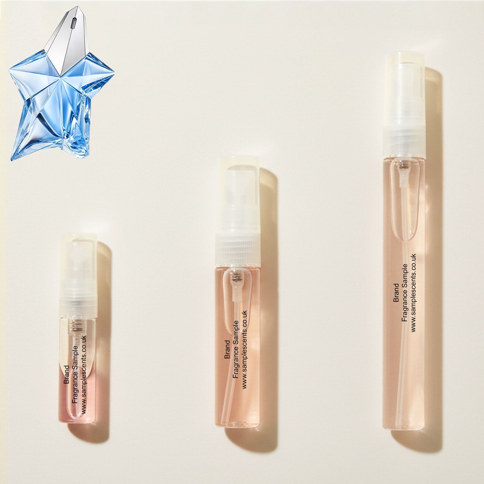 Perfume sample atomisers shown for size reference, hand-decanted from Mugler Angel bottle.