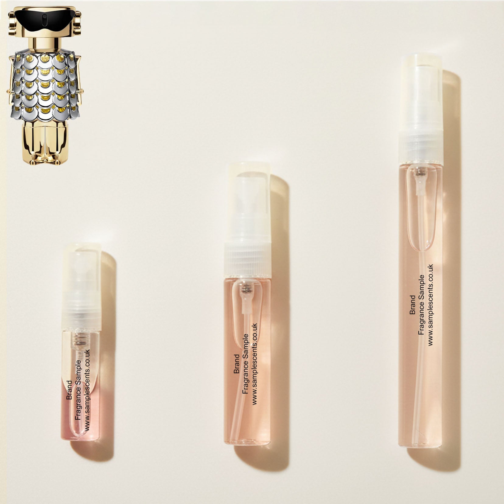 Perfume sample atomisers shown for size reference, hand-decanted from Paco Rabanne Fame bottle.