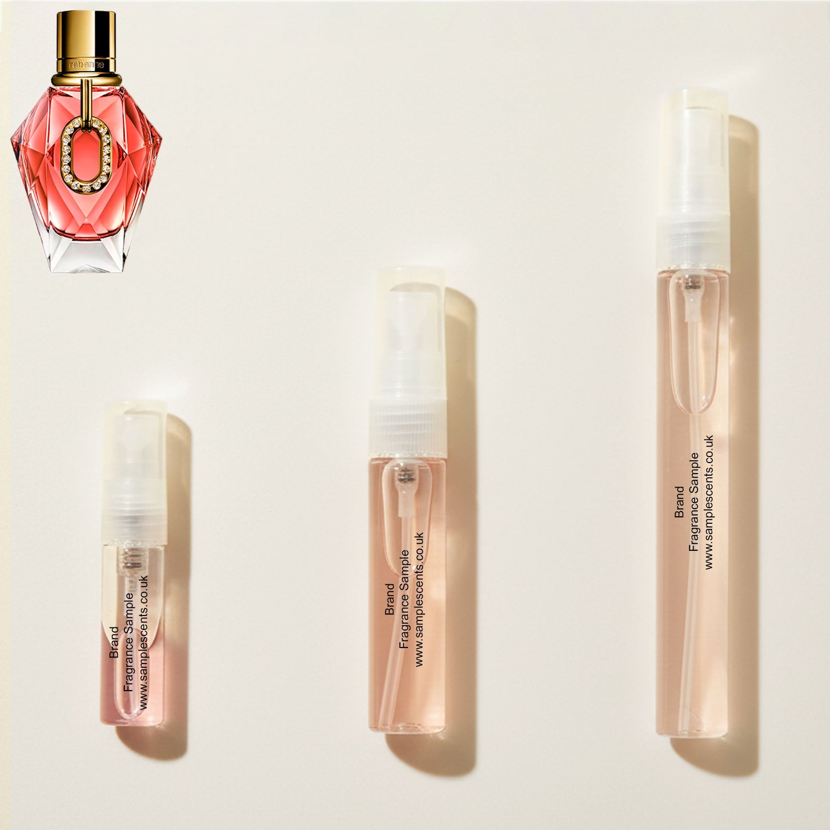 Perfume sample atomisers shown for size reference, hand-decanted from Paco Rabanne Million Gold For Her Pure Diamonds bottle.