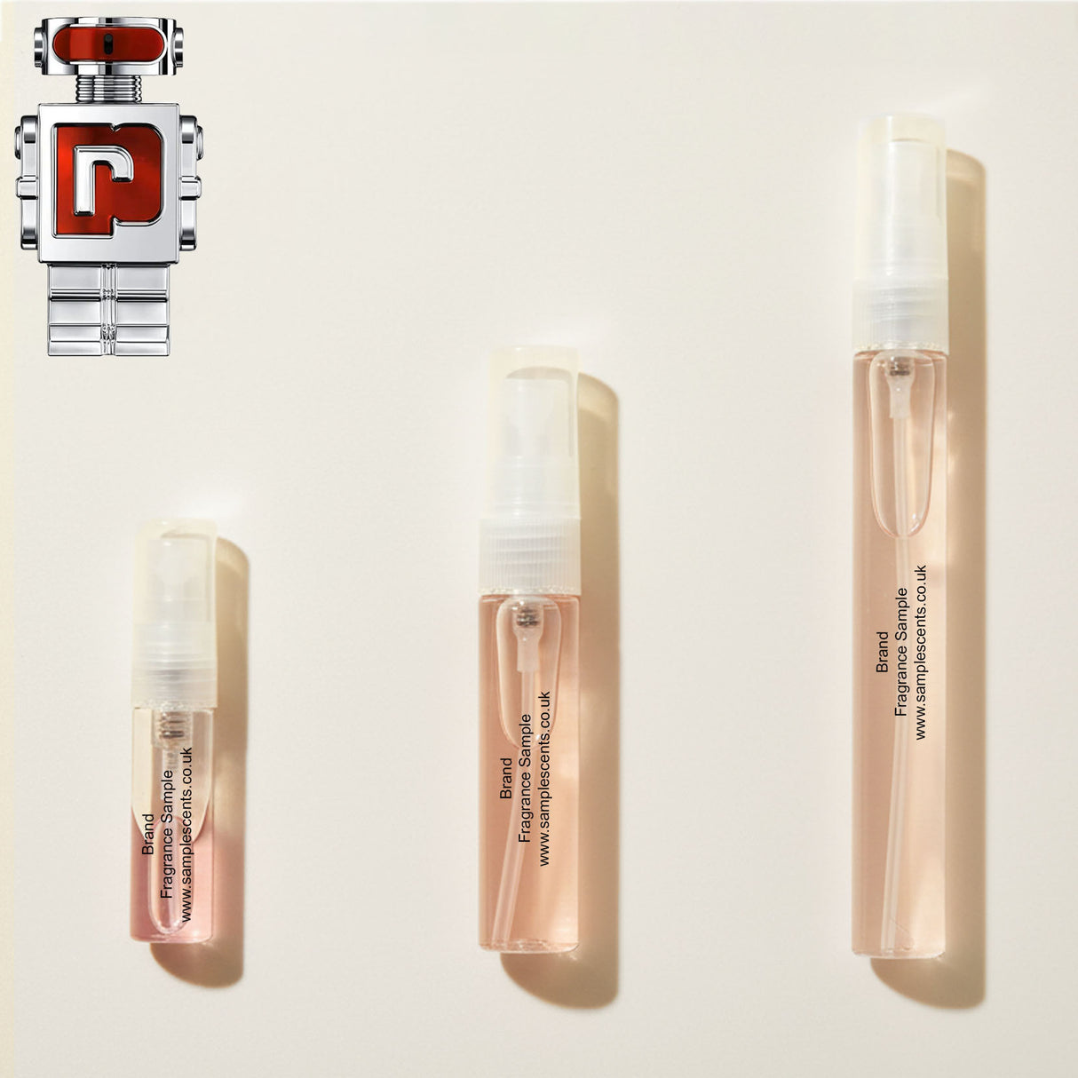 Perfume sample atomisers shown for size reference, hand-decanted from Paco Rabanne Phantom In Red bottle.