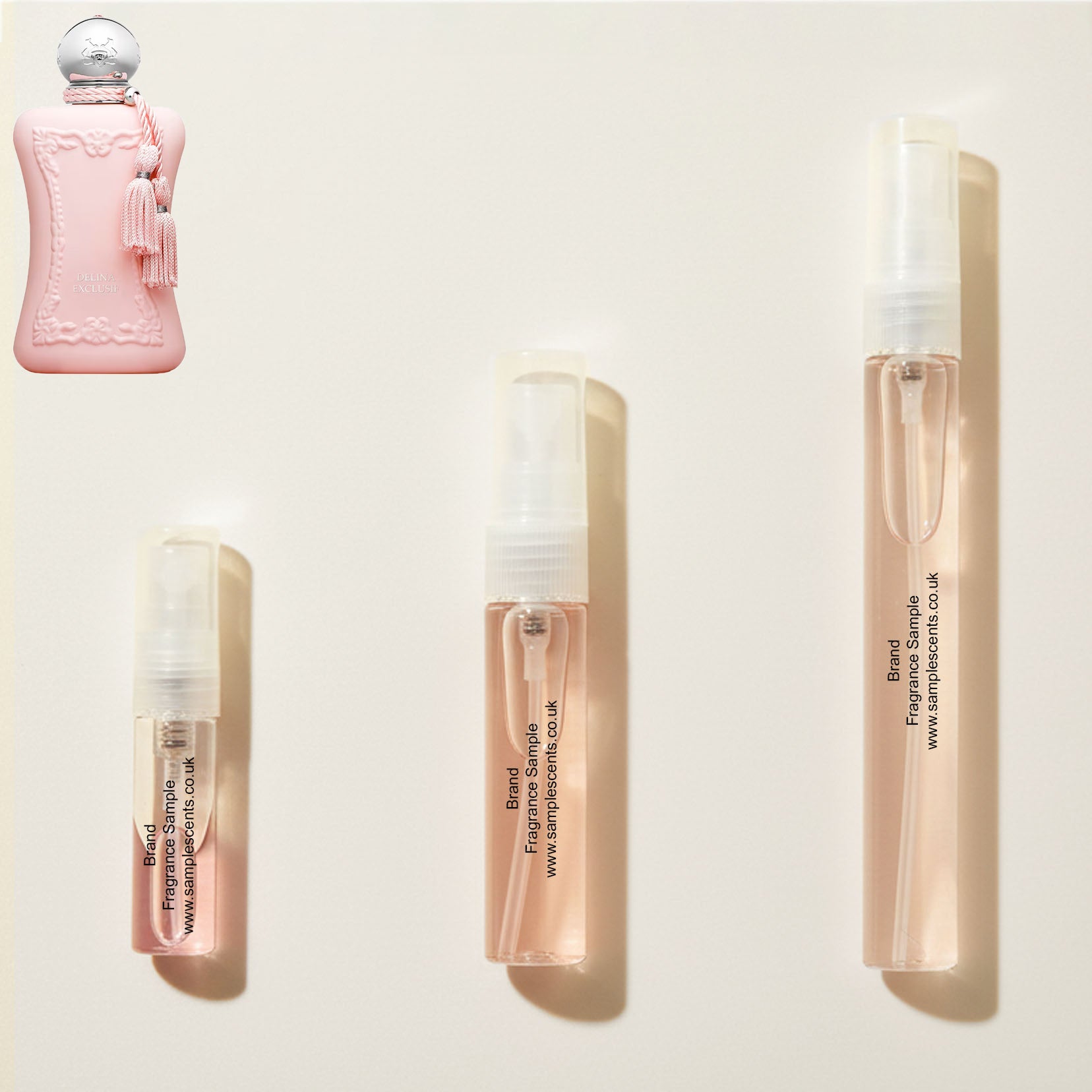 Perfume sample atomisers shown for size reference, hand-decanted from Parfums De Marly Delina Exclusif bottle.