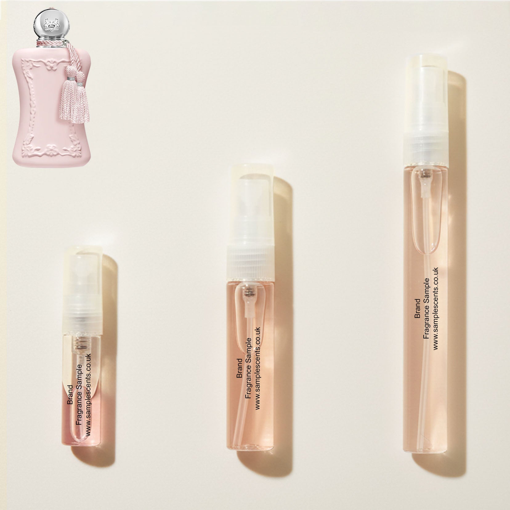 Perfume sample atomisers shown for size reference, hand-decanted from Parfums De Marly Delina bottle.