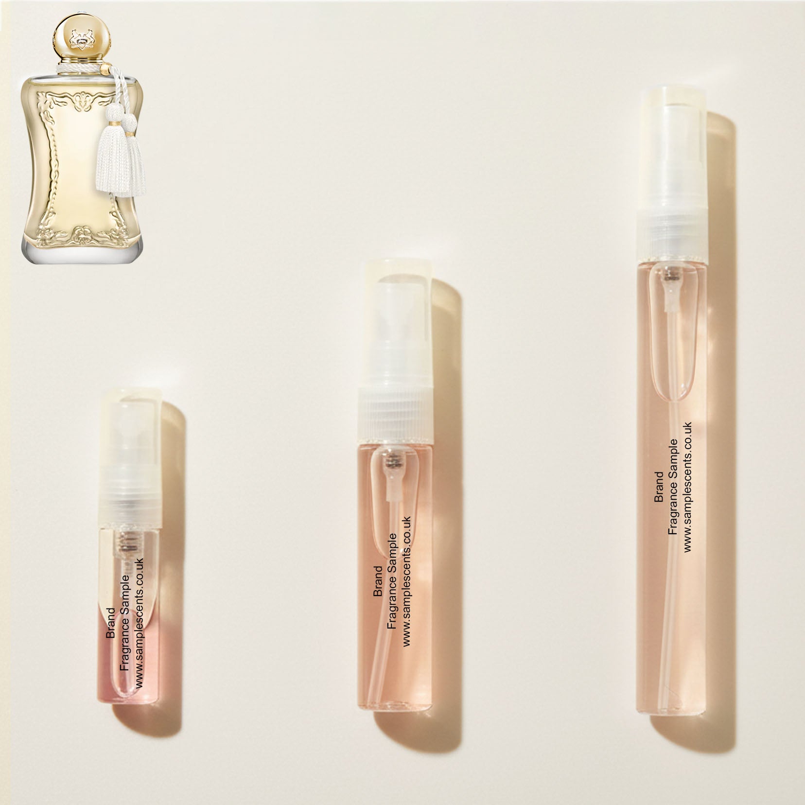 Perfume sample atomisers shown for size reference, hand-decanted from Parfums De Marly Meliora bottle.