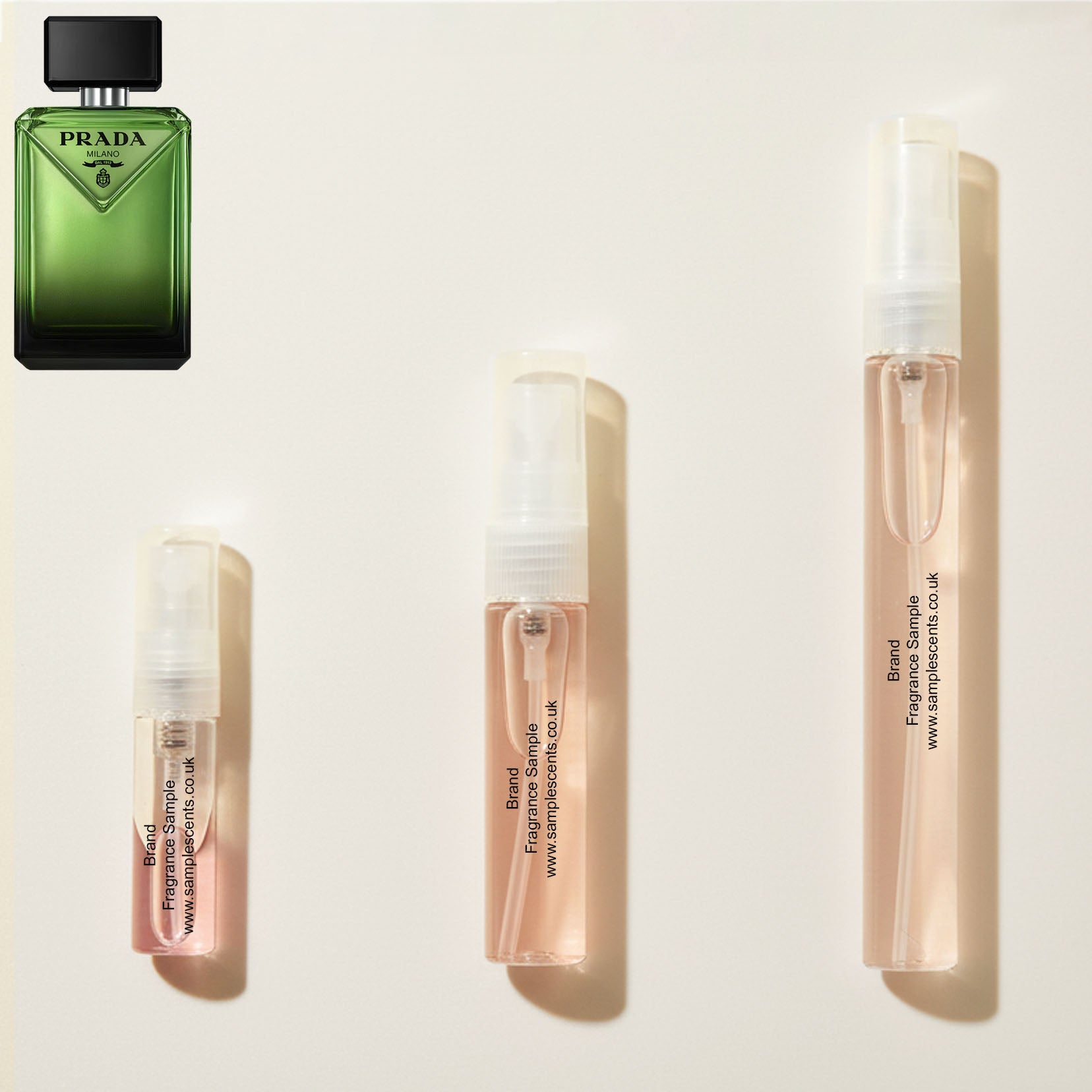 Perfume sample atomisers shown for size reference, hand-decanted from Prada Paradigme bottle.