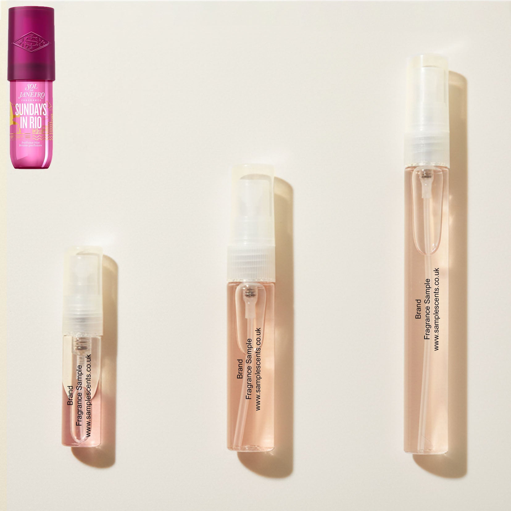 Perfume sample atomisers shown for size reference, hand-decanted from Sol De Janeiro Sundays In Rio bottle.