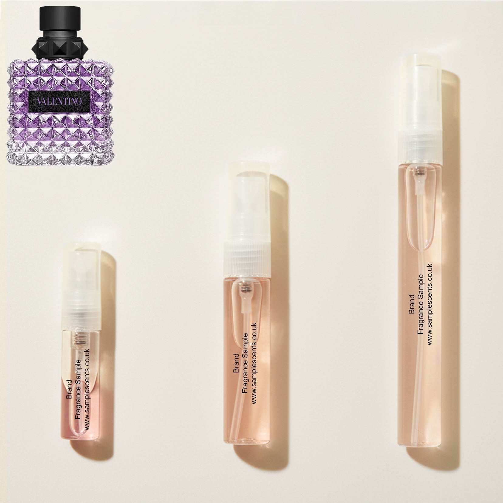 Perfume sample atomisers shown for size reference, hand-decanted from Valentino Born In Roma Donna Purple Malancholia bottle.