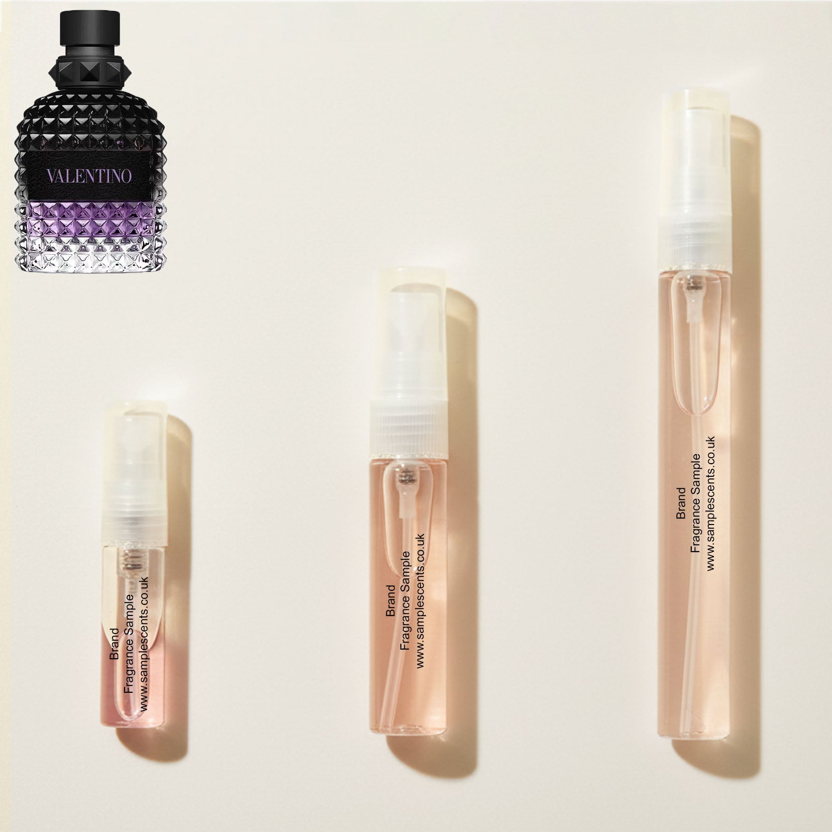 Perfume sample atomisers shown for size reference, hand-decanted from Valentino Born In Roma Uomo Purple Malancholia bottle.