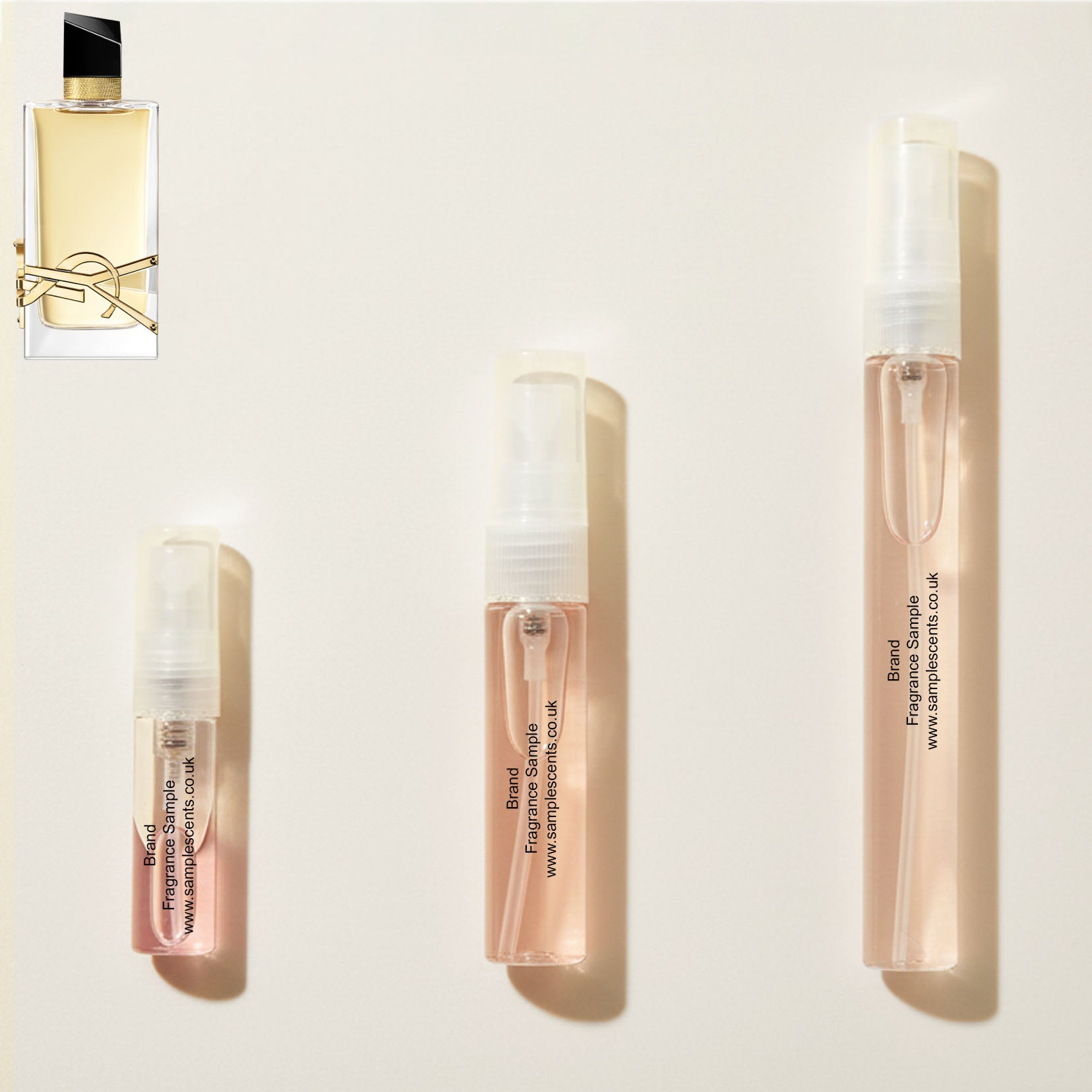 Perfume sample atomisers shown for size reference, hand-decanted from YSL Libre EDP bottle.