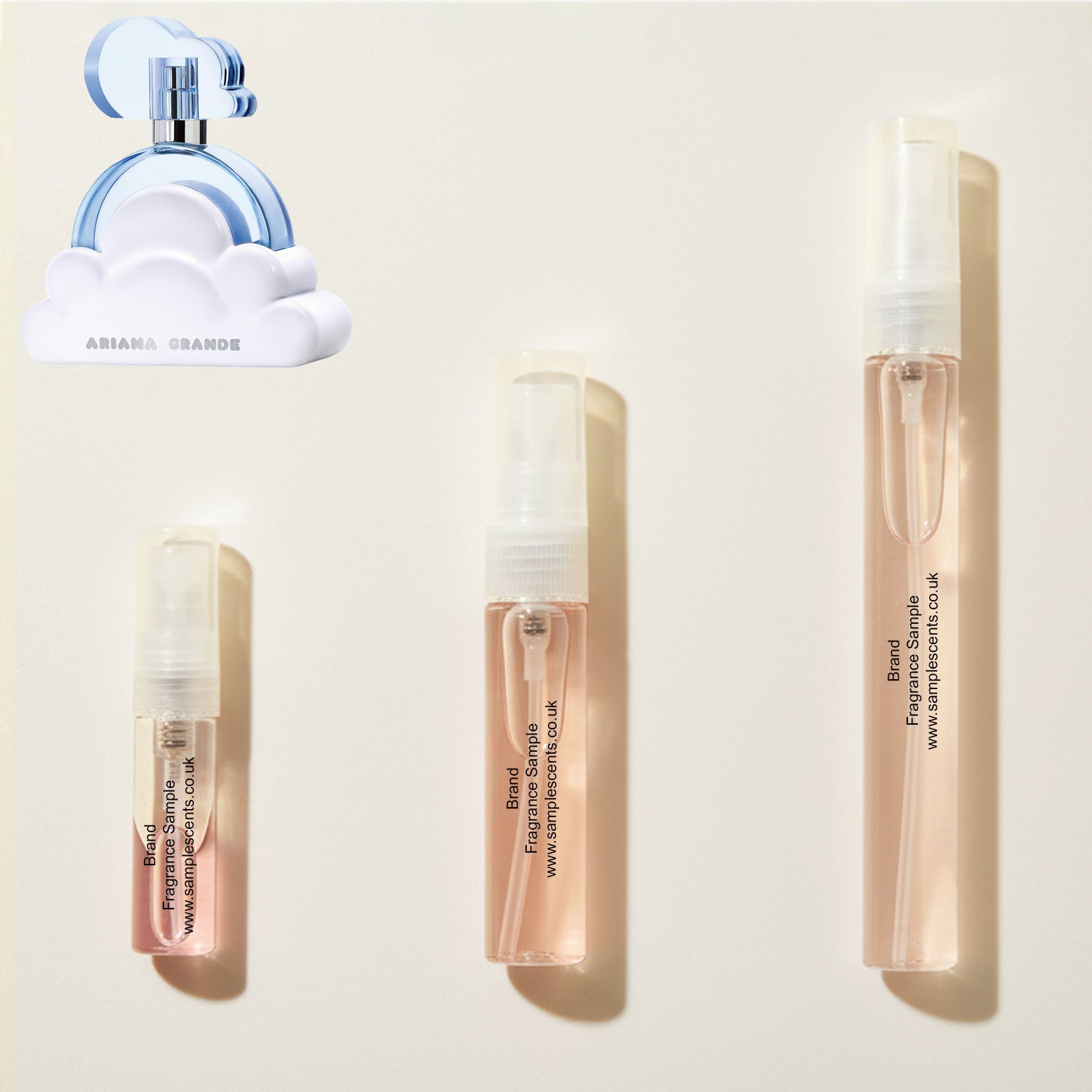 Perfume sample atomisers shown for size reference, hand-decanted from Ariana Grande Cloud bottle.