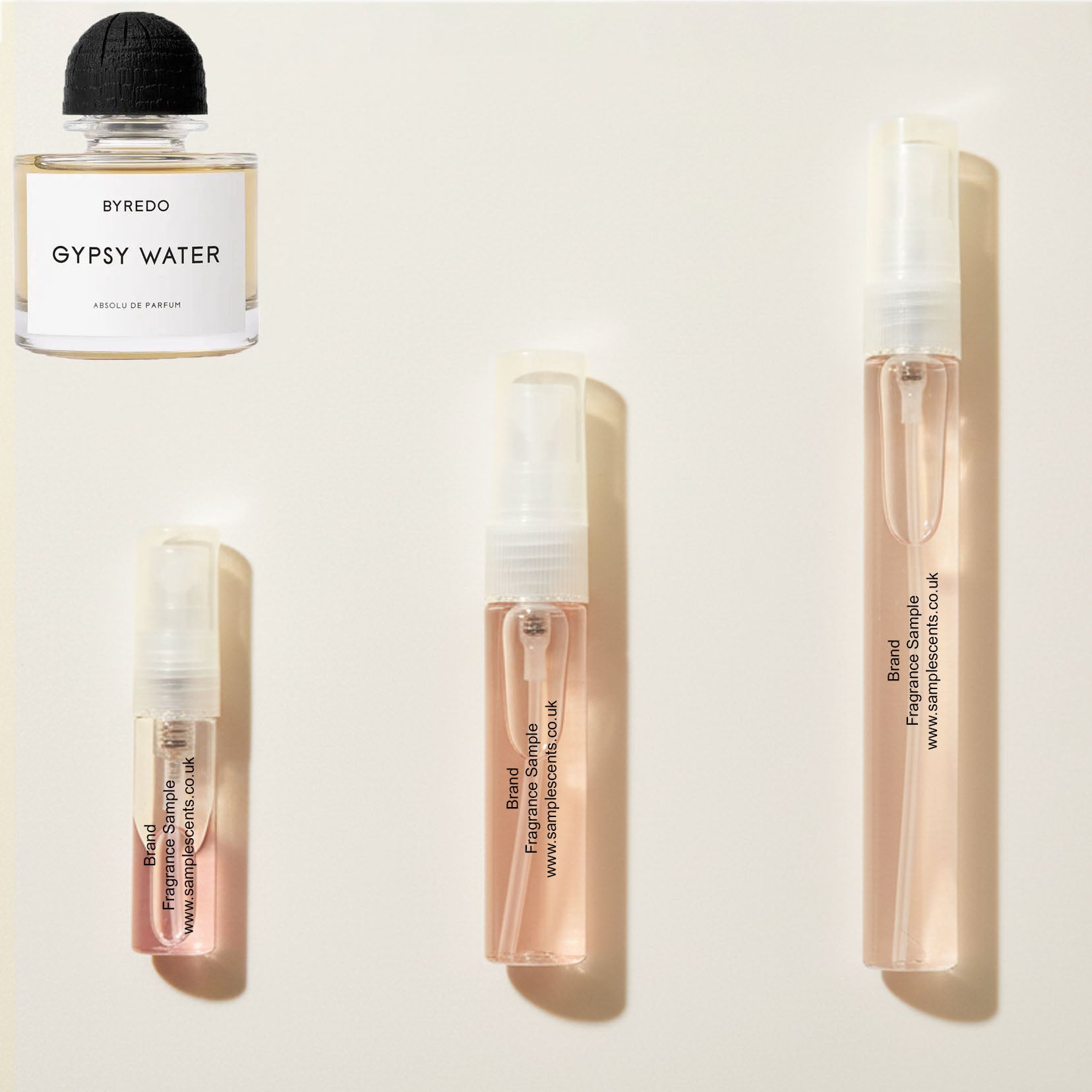 Perfume sample atomisers shown for size reference, hand-decanted from Byredo Gypsy Water Absolu bottle.
