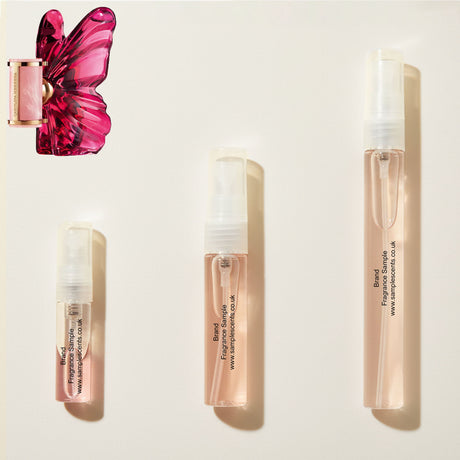 Perfume sample atomisers shown for size reference, hand-decanted from Carolina Herrera La Bomba bottle.