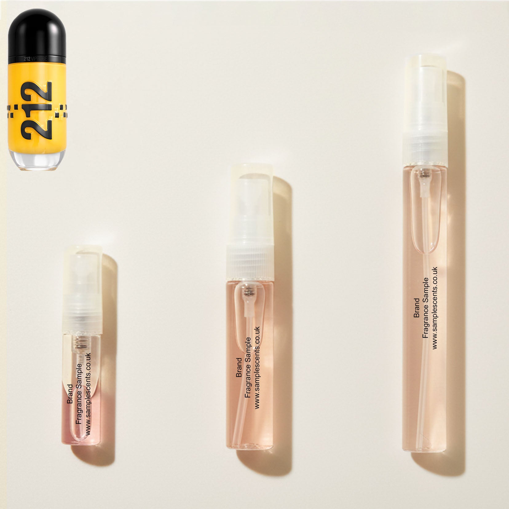 Perfume sample atomisers shown for size reference, hand-decanted from Carolina Herrera VIP Rose Cab bottle.