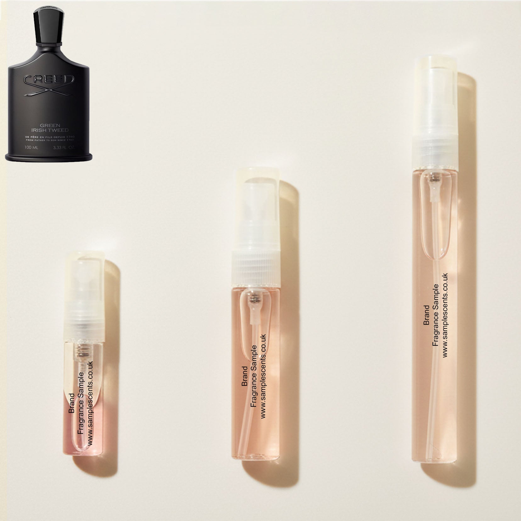 Perfume sample atomisers shown for size reference, hand-decanted from Creed Green Irish Tweed bottle.