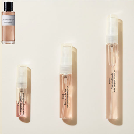 Perfume sample atomisers shown for size reference, hand-decanted from Dior Cuir Saddle bottle.