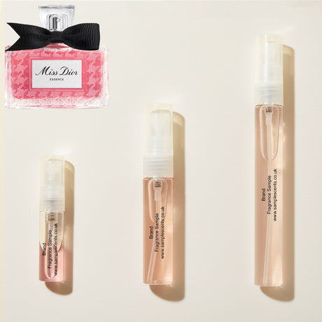 Perfume sample atomisers shown for size reference, hand-decanted from Dior Miss Dior Essence bottle.