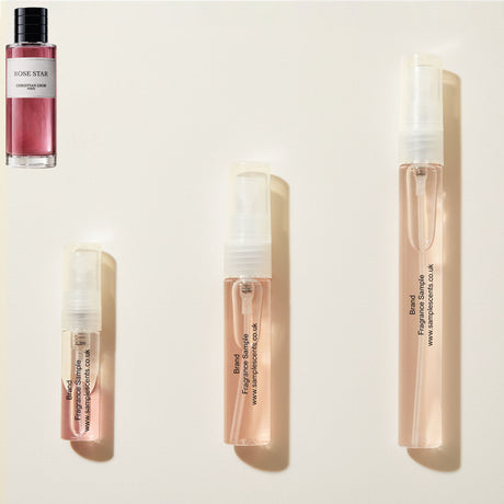 Perfume sample atomisers shown for size reference, hand-decanted from Dior Rose Star bottle.