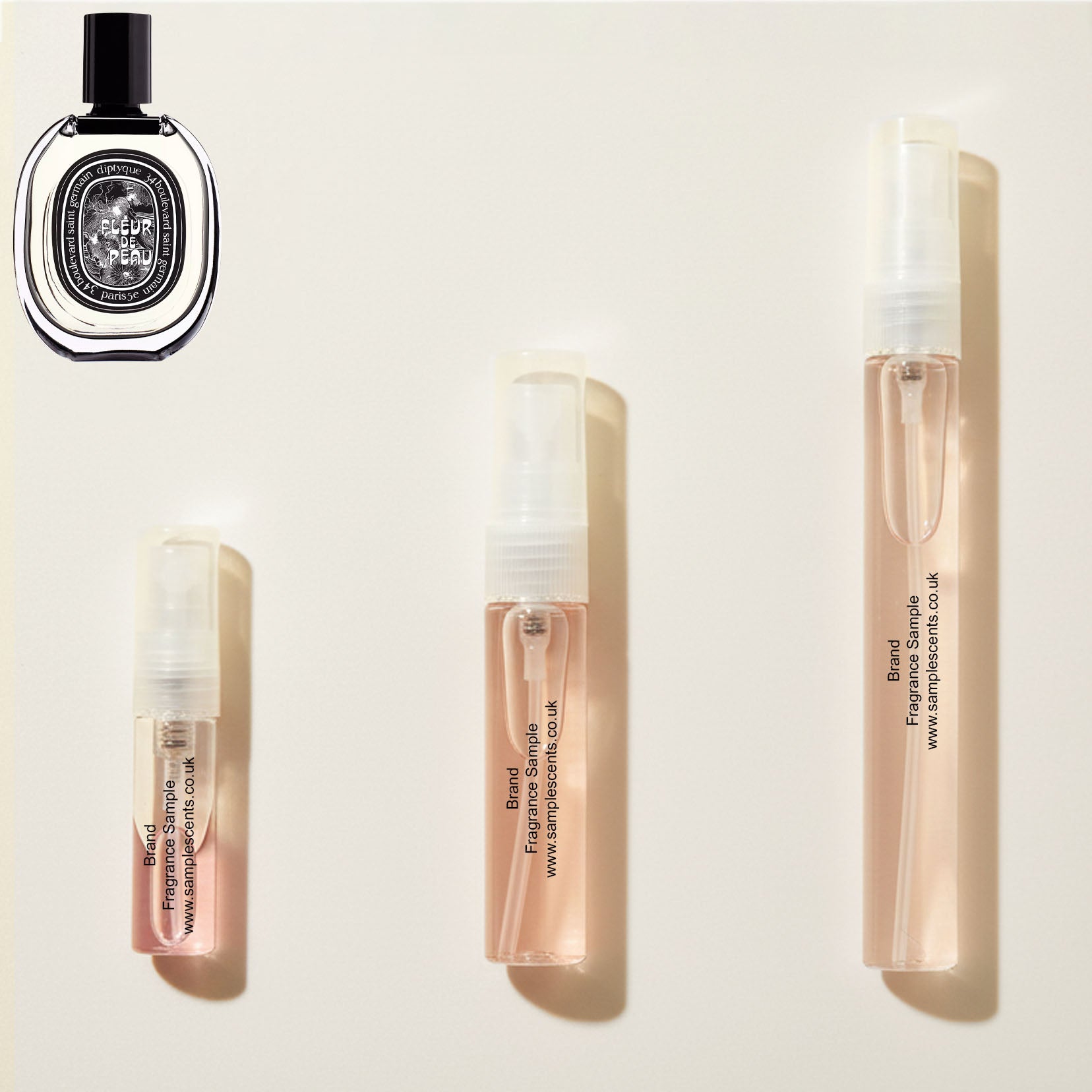 Perfume sample atomisers shown for size reference, hand-decanted from Diptyque Fleur De Peau bottle.