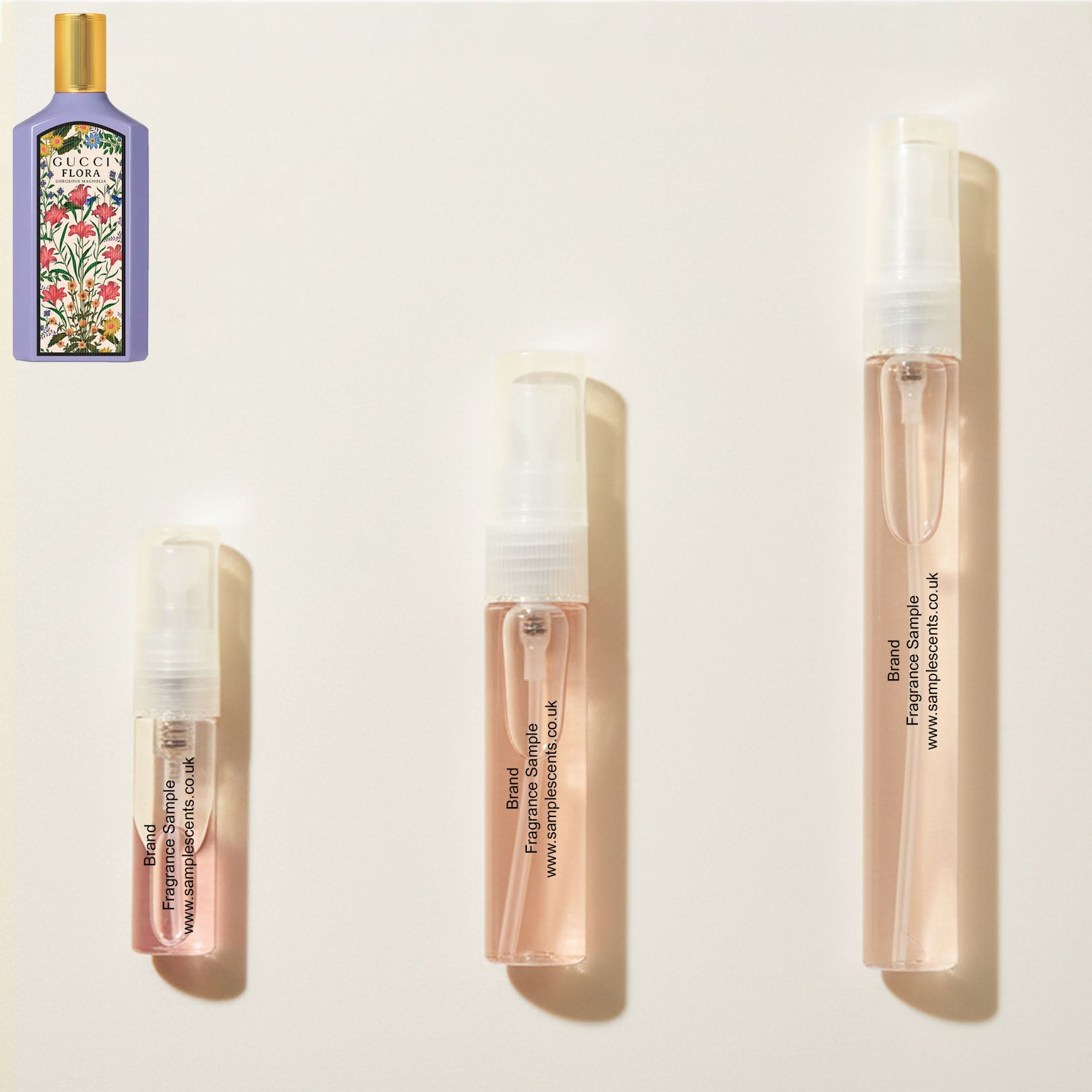 Perfume sample atomisers shown for size reference, hand-decanted from Gucci Flora Gorgeous Magnolia bottle.