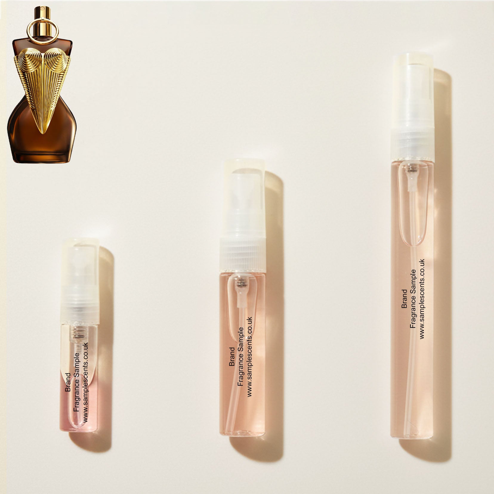 Perfume sample atomisers shown for size reference, hand-decanted from Jean Paul Gaultier Divine Elixir bottle.