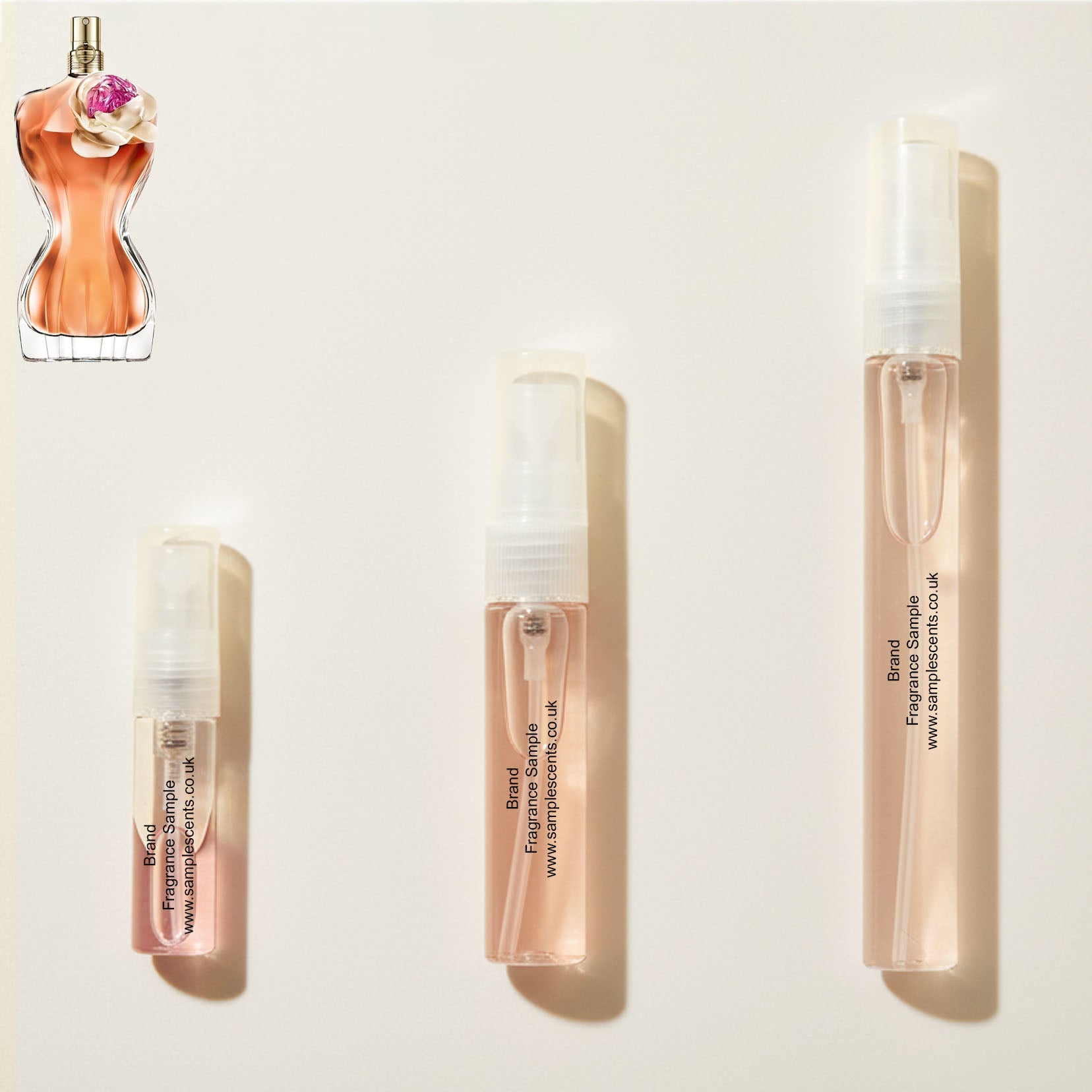 Perfume sample atomisers shown for size reference, hand-decanted from Jean Paul Gualtier La Belle Flower Edition bottle.